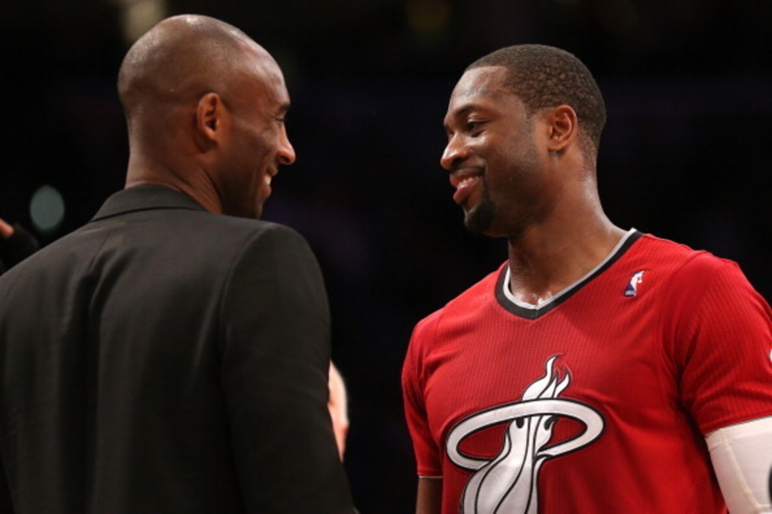 LOS ANGELES, CA - DECEMBER 25:  Dwyane Wade #3 of the Miami Heat and Kobe Bryant #24 of the Los Angeles Lakers meet after the game at Staples Center on December 25, 2013 in Los Angeles, California. The Heat won 101-95.  NOTE TO USER: User expressly acknow