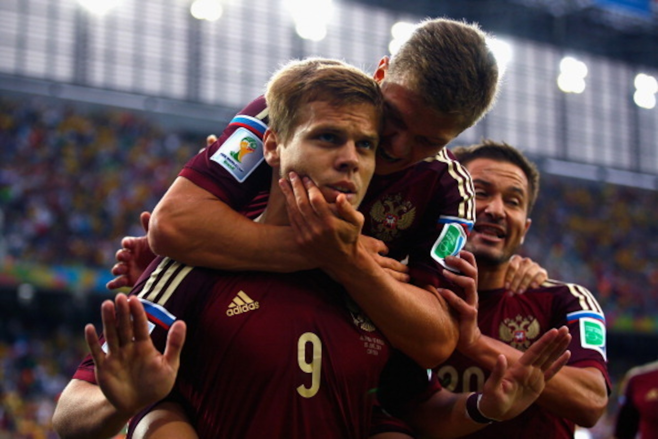 CURITIBA, BRAZIL - JUNE 26:  Alexander Kokorin of Russia celebrates scoring his team's first goal with teammate Oleg Shatov on his back during the 2014 FIFA World Cup Brazil Group H match between Algeria and Russia at Arena da Baixada on June 26, 2014 in 