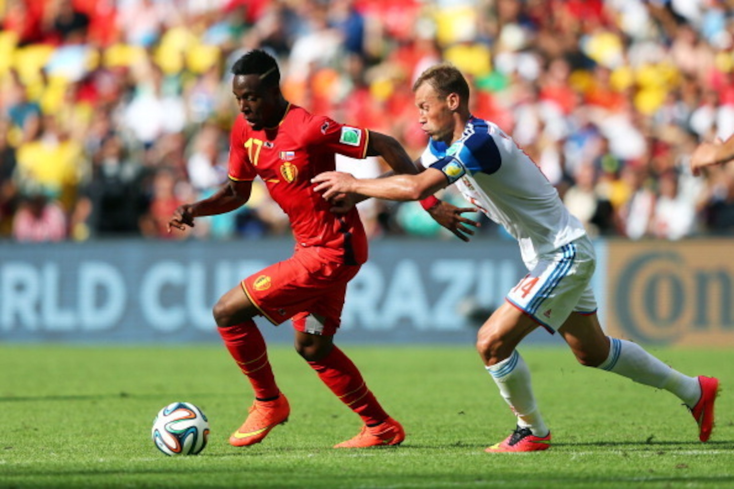 RIO DE JANEIRO, BRAZIL - JUNE 22: Divock Origi of Belgium controls the ball against Vasily Berezutskiy of Russia during the 2014 FIFA World Cup Brazil Group H match between Belgium and Russia at Maracana on June 22, 2014 in Rio de Janeiro, Brazil.  (Photo