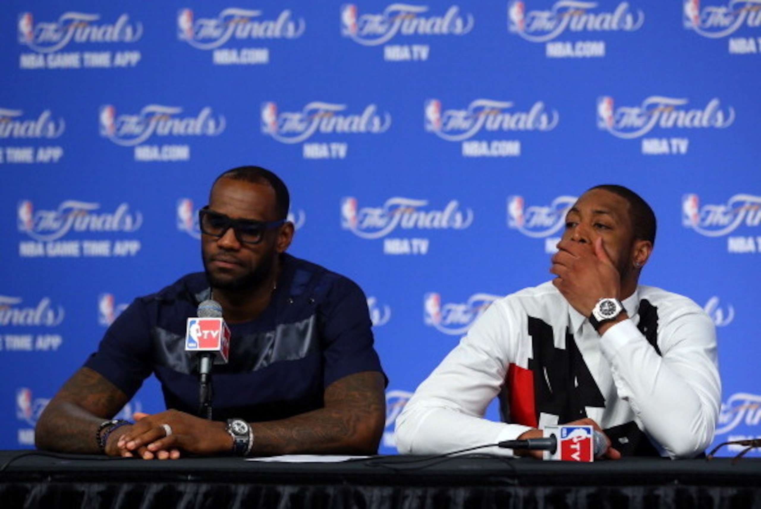 SAN ANTONIO, TX - JUNE 15:  LeBron James #6 and Dwyane Wade #3 of the Miami Heat speak to the media following a 104-87 loss in Game Five of the 2014 NBA Finals at the AT&T Center on June 15, 2014 in San Antonio, Texas. NOTE TO USER: User expressly acknowl