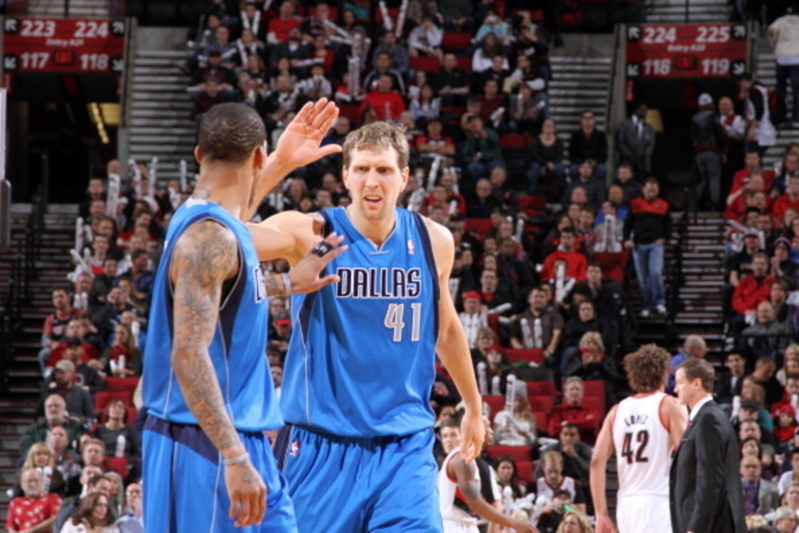 PORTLAND, OR - DECEMBER 7:  Monta Ellis #11 and Dirk Nowitzki #41 of the Dallas Mavericks celebrate against the Portland Trail Blazers on December 7, 2013 at the Moda Center Arena in Portland, Oregon. NOTE TO USER: User expressly acknowledges and agrees t