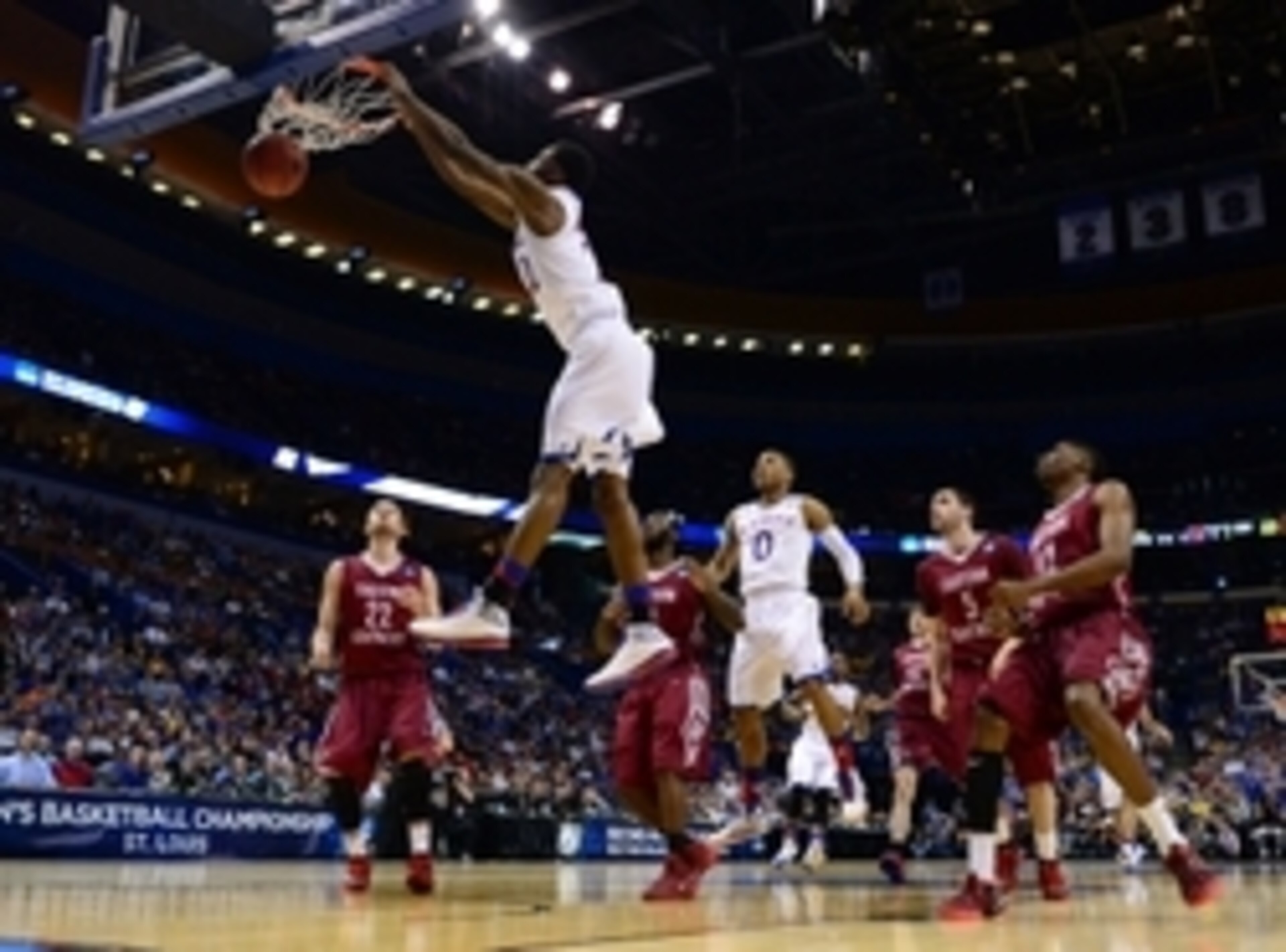Mar 21, 2014; St. Louis, MO, USA; Kansas Jayhawks guard Andrew Wiggins (22) dunks the ball ahead of Eastern Kentucky Colonels guard Isaac McGlone (5), Glenn Cosey (0) and Marcus Lewis (12) in the first half during the 2nd round of the 2014 NCAA Men's Bask Mar 21, 2014; St. Louis, MO, USA; Kansas Jayhawks guard Andrew Wiggins (22) dunks the ball ahead of Eastern Kentucky Colonels guard Isaac McGlone (5), Glenn Cosey (0) and Marcus Lewis (12) in the first half during the 2nd round of the 2014 NCAA Men's Bask