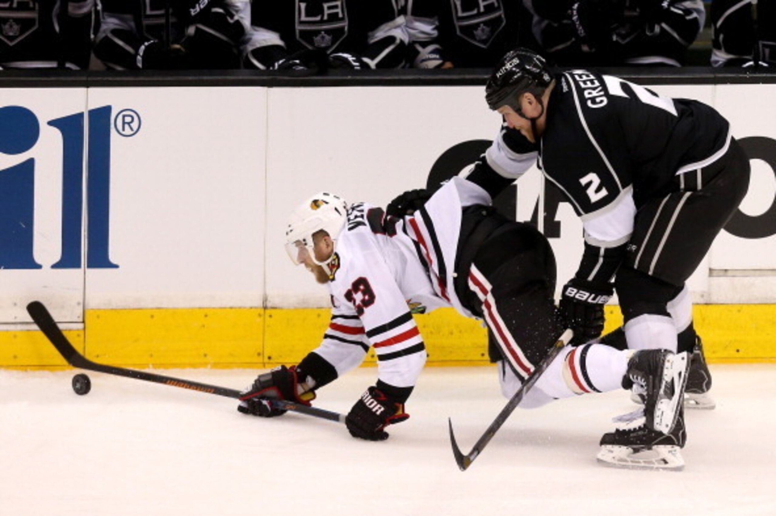 LOS ANGELES, CA - MAY 24:  Kris Versteeg #23 of the Chicago Blackhawks is checked by Matt Greene #2 of the Los Angeles Kings in the third period in Game Three of the Western Conference Final during the 2014 Stanley Cup Playoffs at Staples Center on May 24