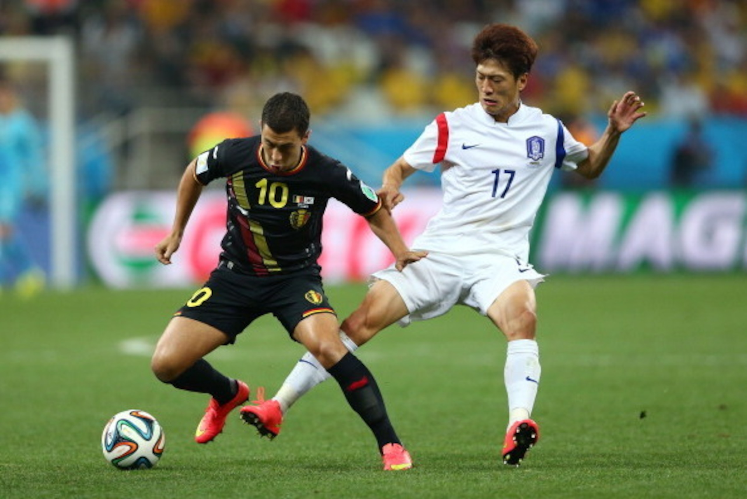 SAO PAULO, BRAZIL - JUNE 26:  Eden Hazard of Belgium and Lee Chung-Yong of South Korea compete for the ball during the 2014 FIFA World Cup Brazil Group H match between South Korea and Belgium at Arena de Sao Paulo on June 26, 2014 in Sao Paulo, Brazil.  (
