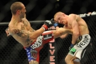 Jul 6, 2013; Las Vegas, NV, USA;  Cub Swanson and Dennis Siver during their Featherweight Bout at the MGM Grand Garden Arena. Mandatory Credit: Jayne Kamin-Oncea-USA TODAY Sports