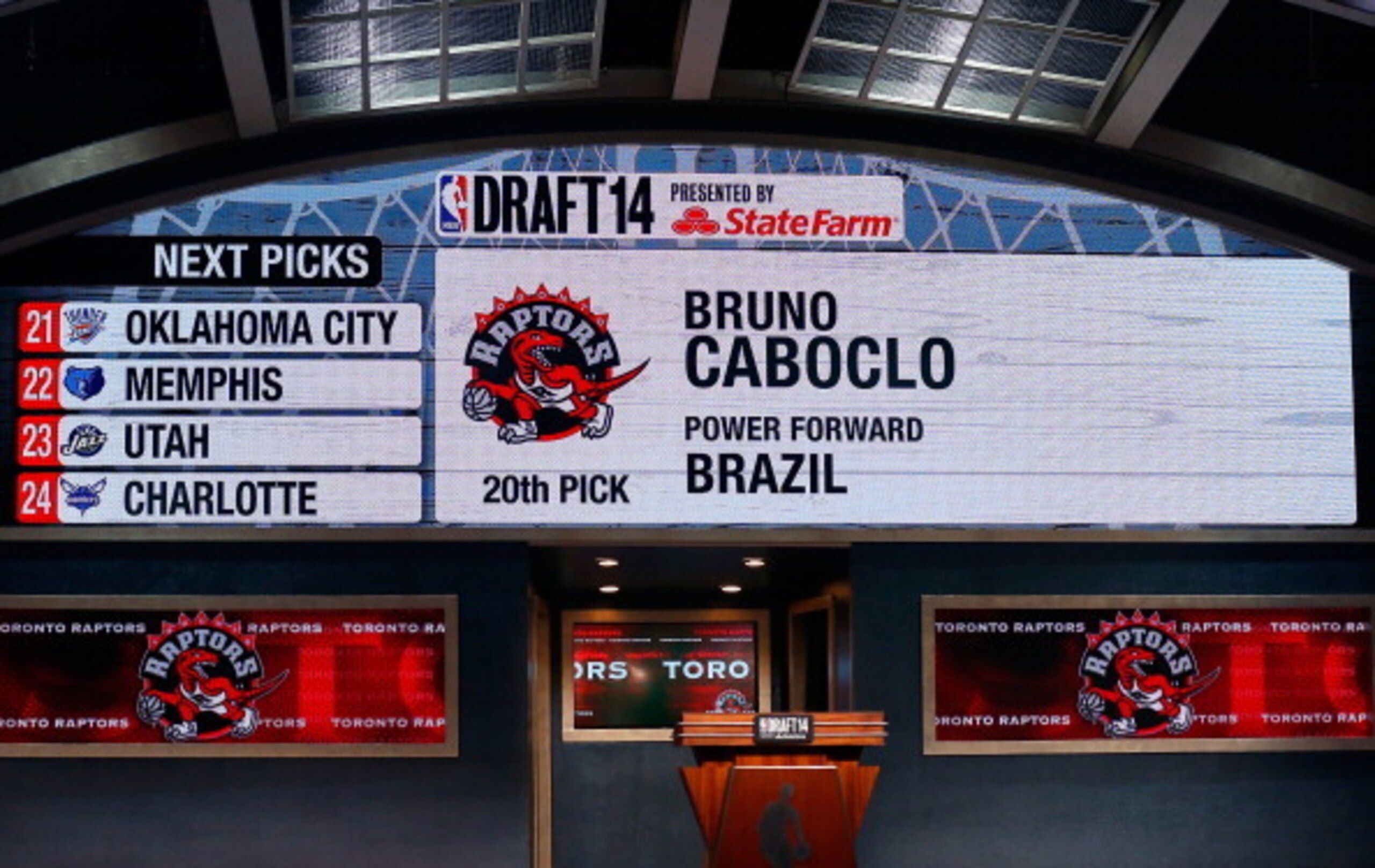 NEW YORK, NY - JUNE 26: A video screen shows the selection of Bruno Caboclo of Brazil as the #20 overall pick in the first round by the Toronto Rapters during the 2014 NBA Draft at Barclays Center on June 26, 2014 in the Brooklyn borough of New York City NEW YORK, NY - JUNE 26: A video screen shows the selection of Bruno Caboclo of Brazil as the #20 overall pick in the first round by the Toronto Rapters during the 2014 NBA Draft at Barclays Center on June 26, 2014 in the Brooklyn borough of New York City