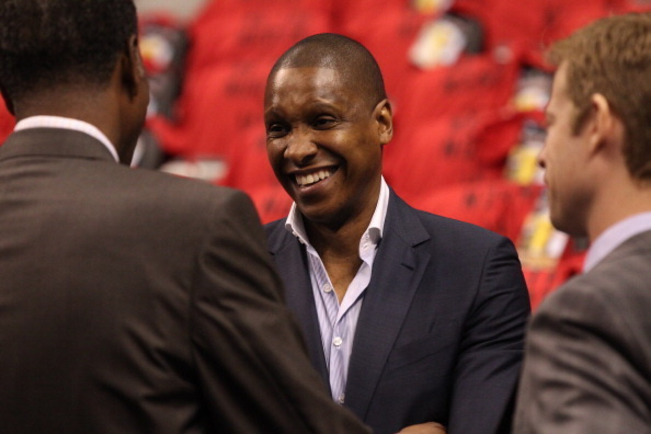 TORONTO,ON - MAY 4: General manager Masai Ujiri of the Toronto Raptors speaks with colleagues before Game seven of the Quarterfinal NBA Eastern Conference playoff game against the Brooklyn Nets at the Air Canada Centre on May 4, 2014 in Toronto, Ontario, TORONTO,ON - MAY 4: General manager Masai Ujiri of the Toronto Raptors speaks with colleagues before Game seven of the Quarterfinal NBA Eastern Conference playoff game against the Brooklyn Nets at the Air Canada Centre on May 4, 2014 in Toronto, Ontario,