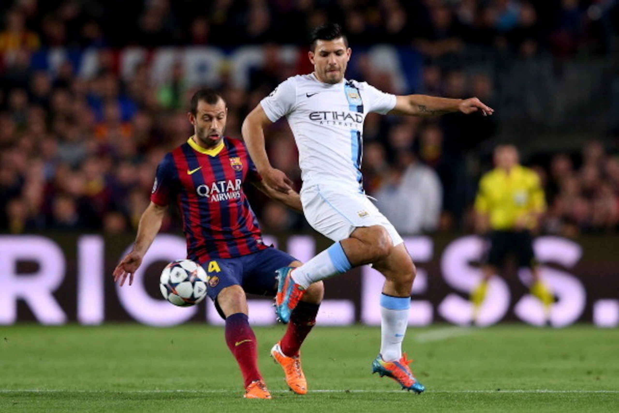BARCELONA, SPAIN - MARCH 12:  Sergio Aguero of Manchester City controls the ball as Javier Mascherano of Barcelona closes in during the UEFA Champions League Round of 16, second leg match between FC Barcelona and Manchester City  at Camp Nou on March 12, 