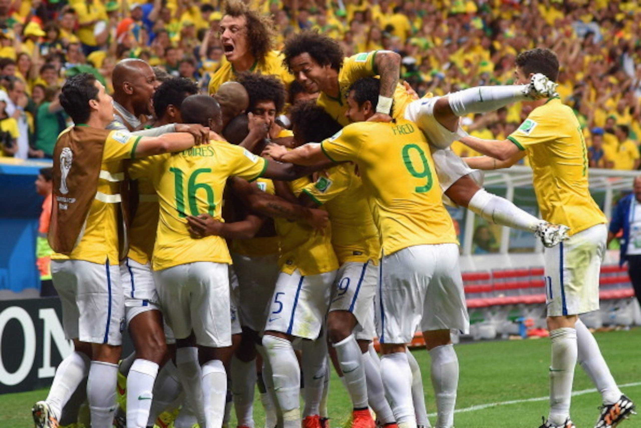 BRASILIA, BRAZIL - JUNE 23: Fernandinho of Brazil (obscured) celebrates scoring his team's fourth goal with teammates during the 2014 FIFA World Cup Brazil Group A match between Cameroon and Brazil at Estadio Nacional on June 23, 2014 in Brasilia, Brazil BRASILIA, BRAZIL - JUNE 23: Fernandinho of Brazil (obscured) celebrates scoring his team's fourth goal with teammates during the 2014 FIFA World Cup Brazil Group A match between Cameroon and Brazil at Estadio Nacional on June 23, 2014 in Brasilia, Brazil
