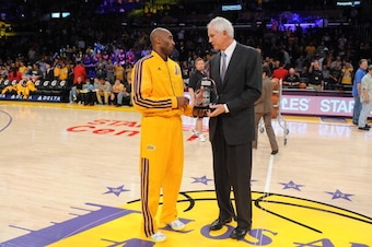 LOS ANGELES, CA - MARCH 22: Kobe Bryant #24 of the Los Angeles Lakers is presented with the Kia Western Conference player of the month award for February 2013 by general manager Mitch Kupchak before their team's game against the Washington Wizards at Stap