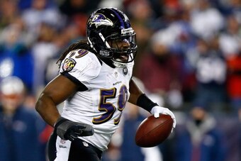 FOXBORO, MA - JANUARY 20:  Dannell Ellerbe #59 of the Baltimore Ravens celebrates after intercepting a pass by Tom Brady #12 of the New England Patriots in the fourth quarter during the 2013 AFC Championship game at Gillette Stadium on January 20, 2013 in