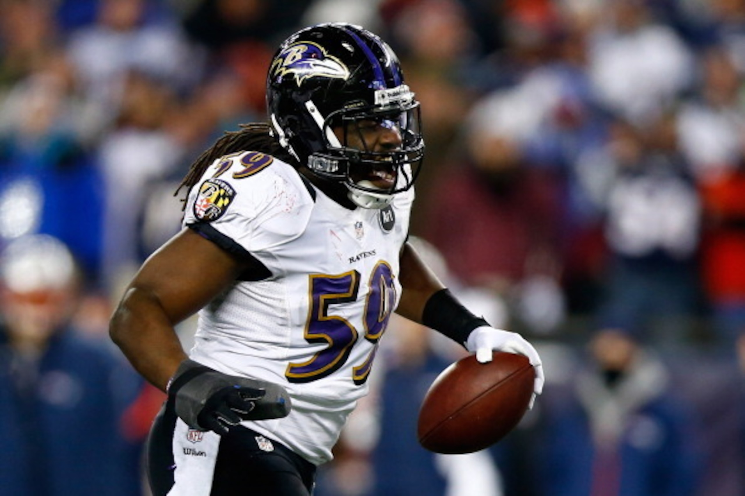 FOXBORO, MA - JANUARY 20:  Dannell Ellerbe #59 of the Baltimore Ravens celebrates after intercepting a pass by Tom Brady #12 of the New England Patriots in the fourth quarter during the 2013 AFC Championship game at Gillette Stadium on January 20, 2013 in