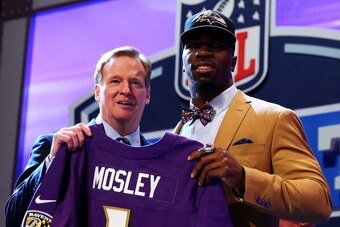 NEW YORK, NY - MAY 08:  C.J. Mosley of the Alabama Crimson Tide poses with NFL Commissioner Roger Goodell after he was picked #17 overall by the Baltimore Ravens during the first round of the 2014 NFL Draft at Radio City Music Hall on May 8, 2014 in New Y