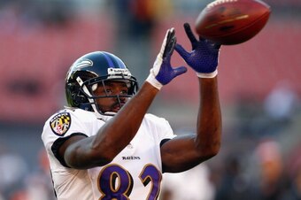CLEVELAND, OH - NOVEMBER 03:  Wide receiver Torrey Smith #82 of the Baltimore Ravens catches a pass before their game against the Cleveland Browns at FirstEnergy Stadium on November 3, 2013 in Cleveland, Ohio.  (Photo by Matt Sullivan/Getty Images)