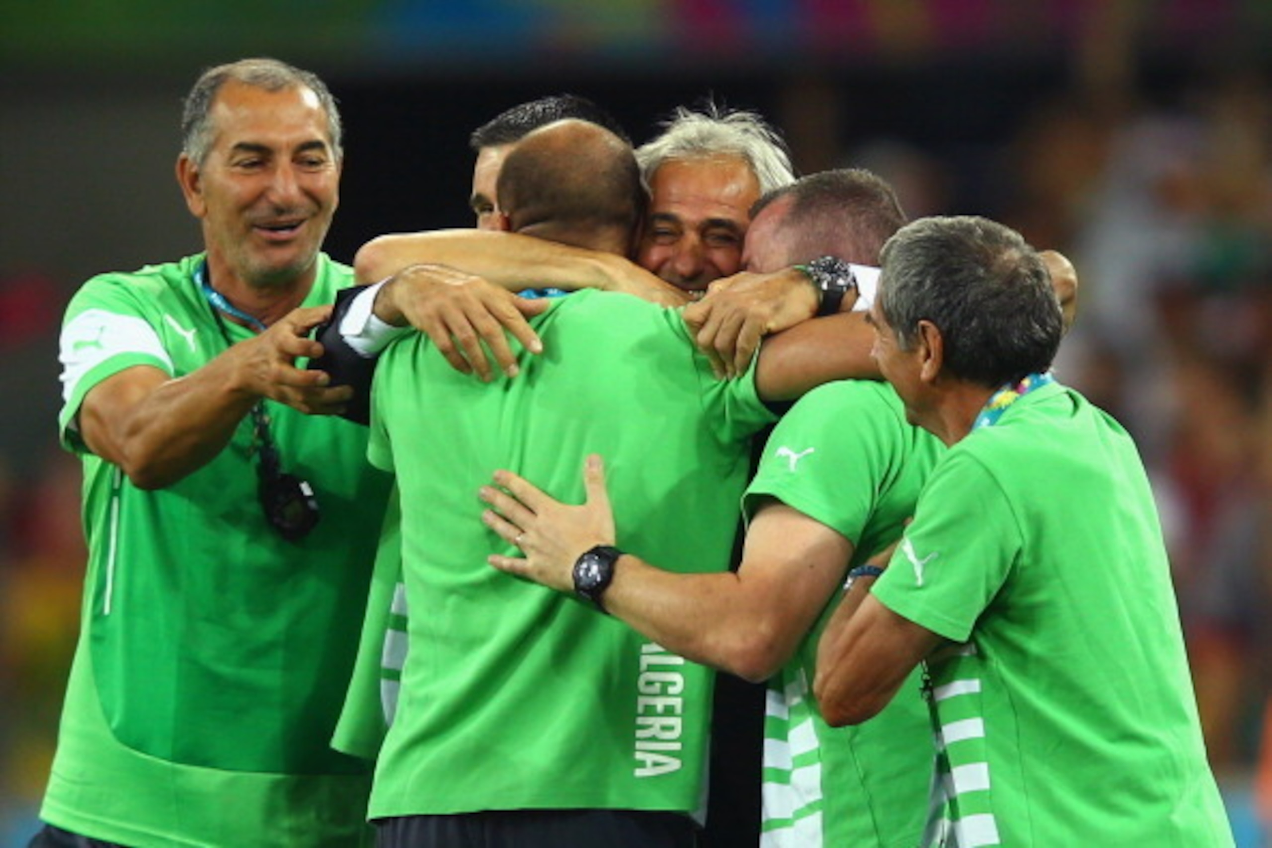 CURITIBA, BRAZIL - JUNE 26: Head coach Vahid Halilhodzic of Algeria (C) hugs his staff after a 1-1 draw during the 2014 FIFA World Cup Brazil Group H match between Algeria and Russia at Arena da Baixada on June 26, 2014 in Curitiba, Brazil.  (Photo by Cli