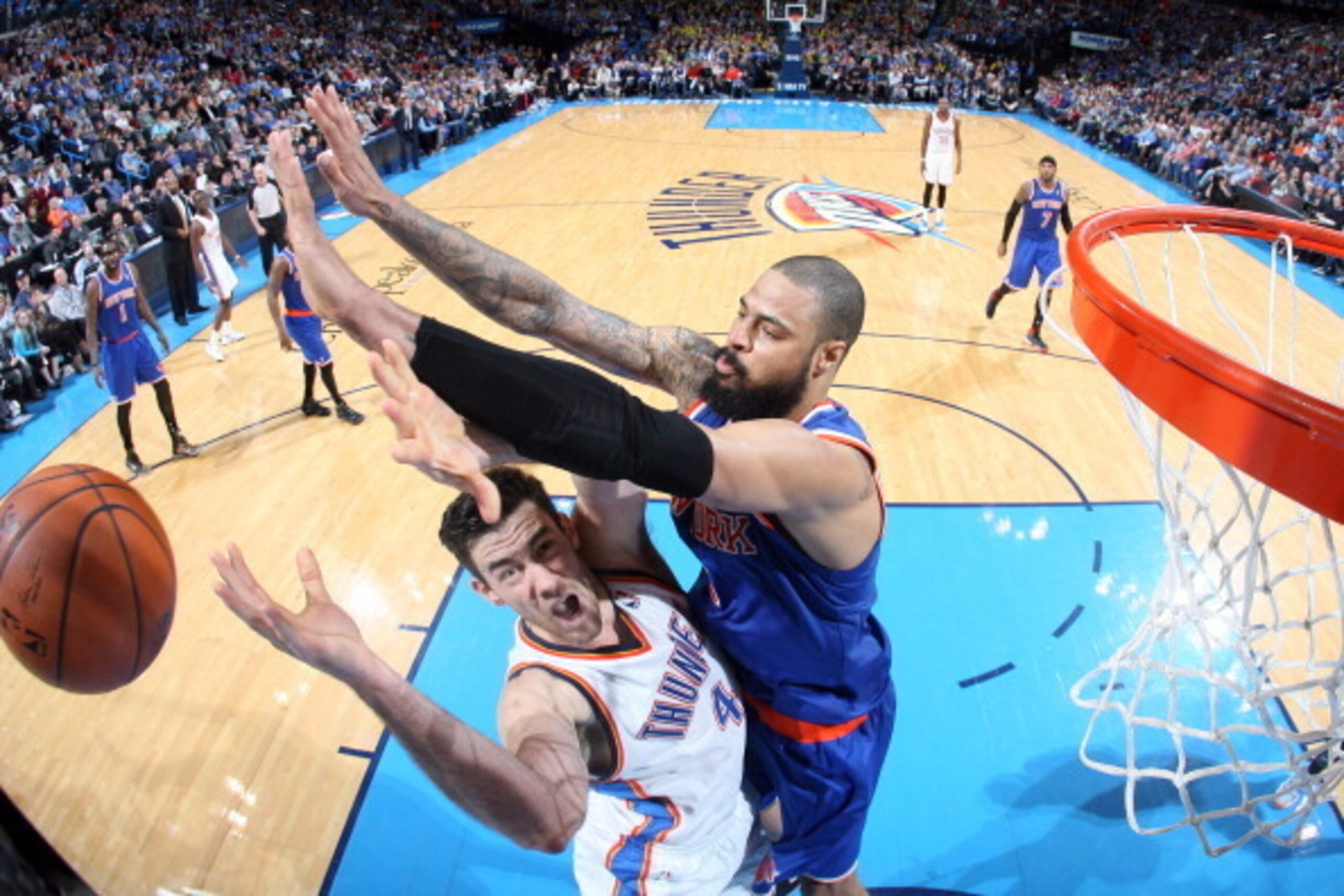 OKLAHOMA CITY, OK - FEBRUARY 9: Tyson Chandler #6 of the New York Knicks blocks a shot against Nick Collison #4 of the Oklahoma City Thunder on February 9, 2014 at the Chesapeake Energy Arena in Oklahoma City, Oklahoma. NOTE TO USER: User expressly acknow