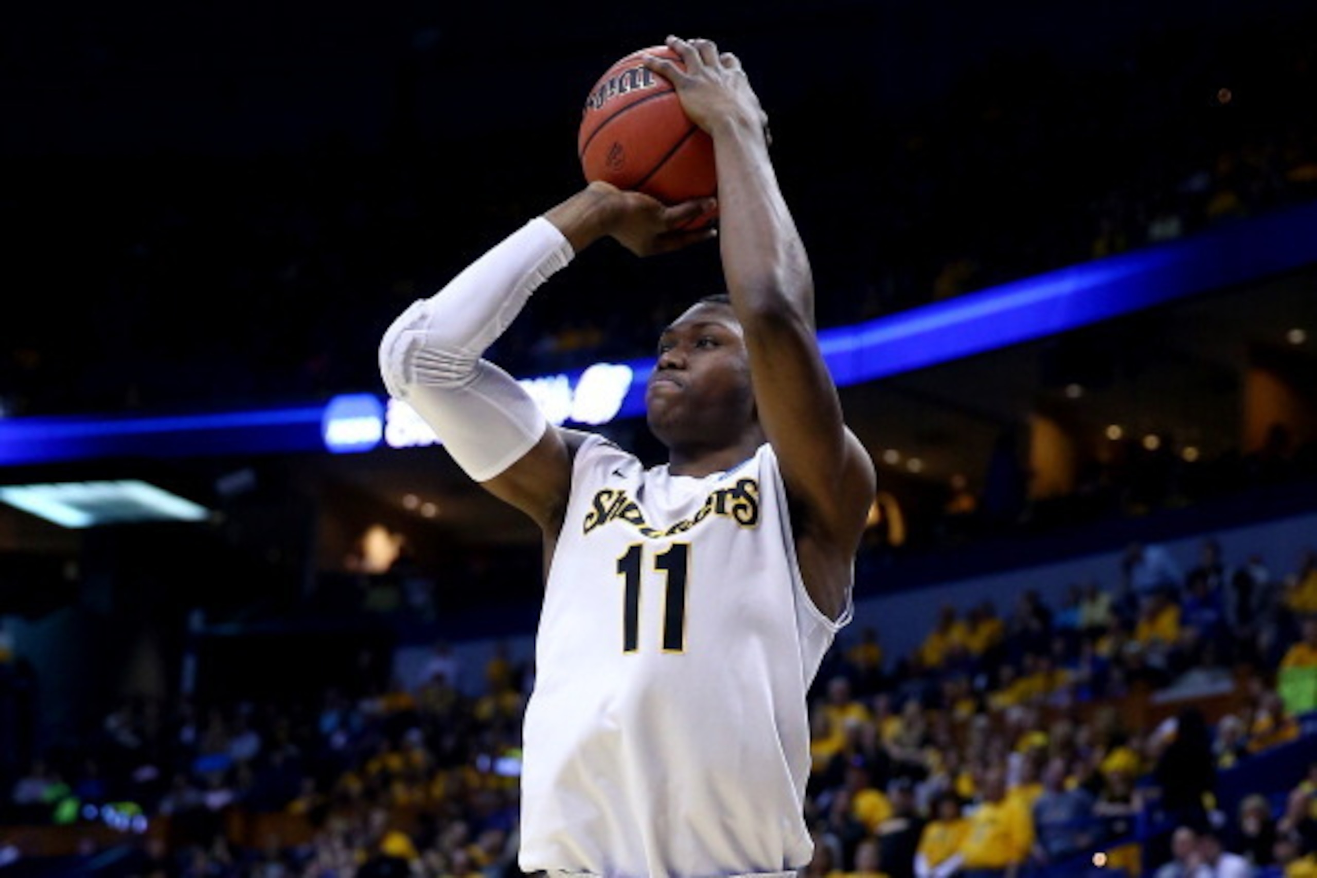 ST LOUIS, MO - MARCH 21:  Cleanthony Early #11 of the Wichita State Shockers takes a shot against the Cal Poly Mustangs during the second round of the 2014 NCAA Men's Basketball Tournament at the Scottrade Center on March 21, 2014 in St Louis, Missouri.  