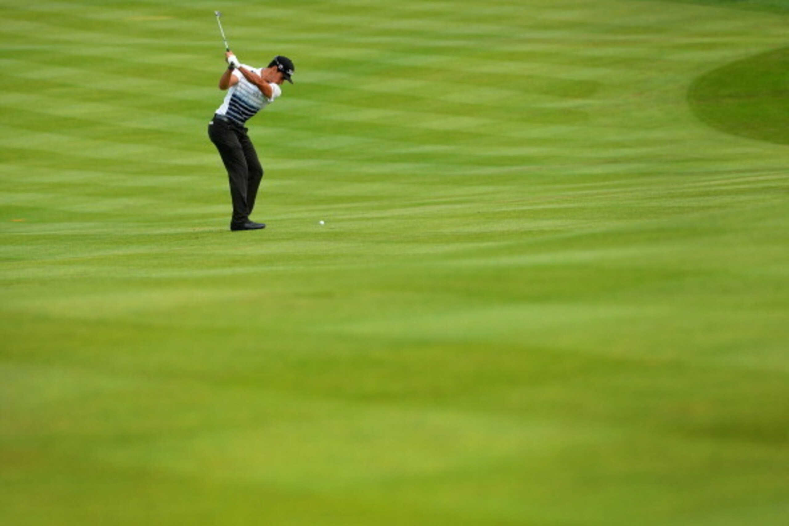 COLOGNE, GERMANY - June 27 : Rafa Cabrera-Bello of Spain plays his approach shot to the 14th green during the second round of the BMW International Open at Golf Club Gut Larchenhof on June 27, 2014 in Cologne, Germany. (Photo by Mark Runnacles/Getty Image