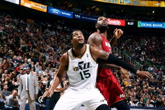 SALT LAKE CITY, UT - FEBRUARY 08:  Derrick Favors #15 of the Utah Jazz and Greg Oden #20 of the Miami Heat look for a rebound at EnergySolutions Arena on February 08, 2014 in Salt Lake City, Utah. NOTE TO USER: User expressly acknowledges and agrees that,
