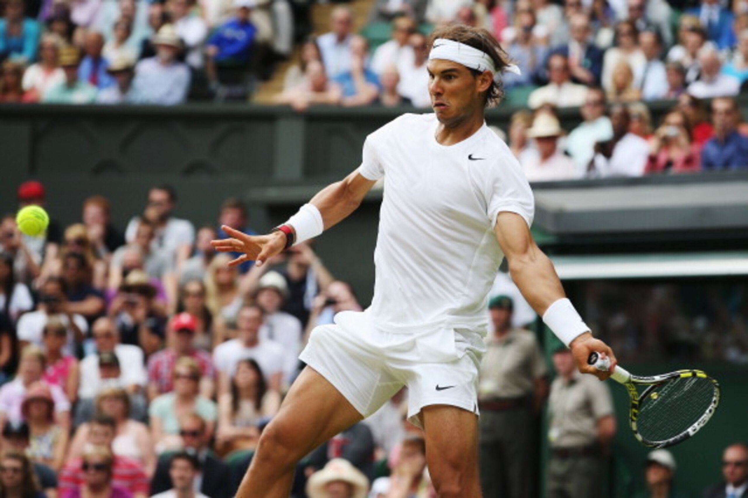 LONDON, ENGLAND - JUNE 26:  Rafael Nadal of Spain in action during his Gentlemen's Singles second round match against Lukas Rosol of Czech Republic on day four of the Wimbledon Lawn Tennis Championships at the All England Lawn Tennis and Croquet Club at W