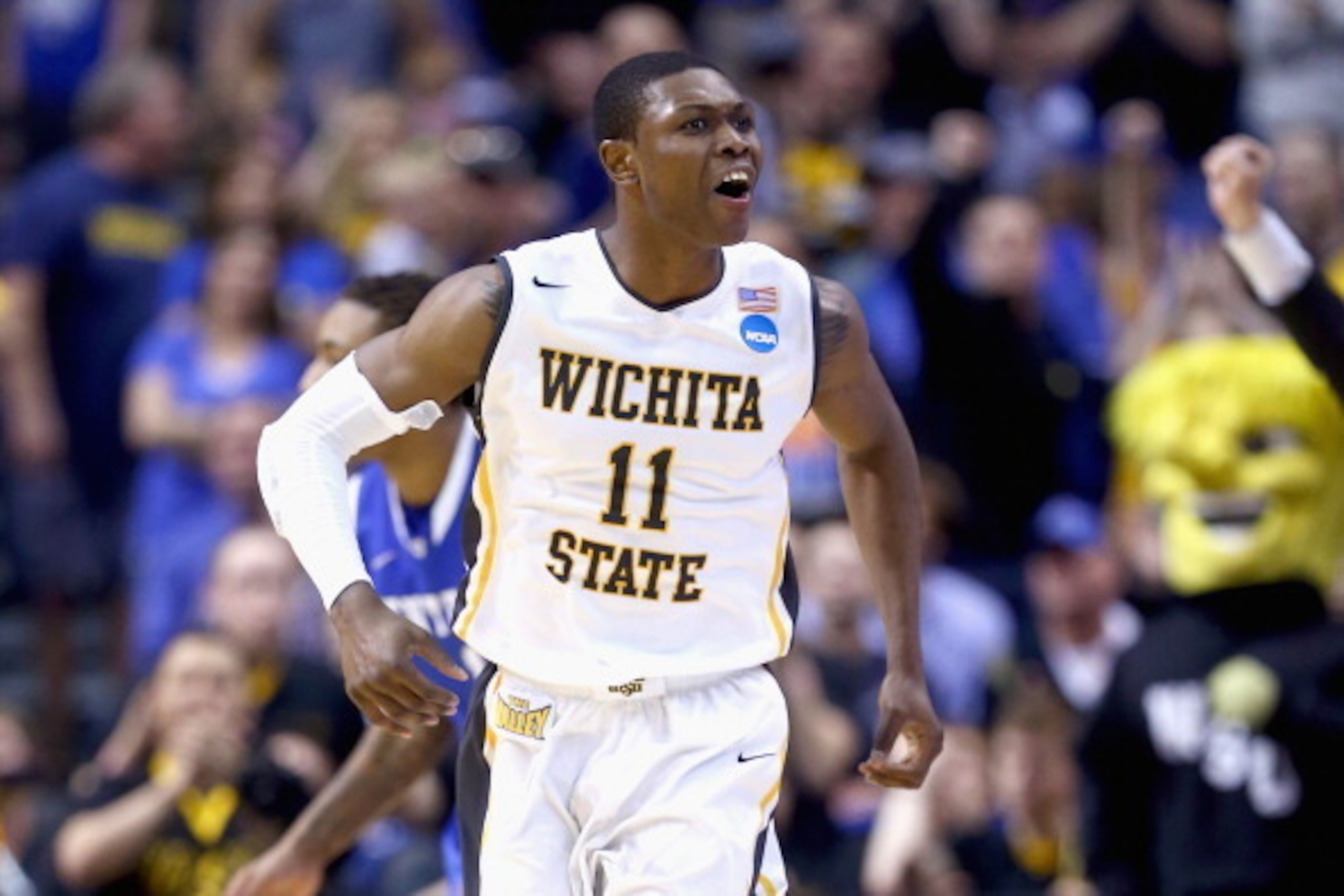 ST LOUIS, MO - MARCH 23:  Cleanthony Early #11 of the Wichita State Shockers celebrates after a basket in the second half against the Kentucky Wildcats during the third round of the 2014 NCAA Men's Basketball Tournament at Scottrade Center on March 23, 20