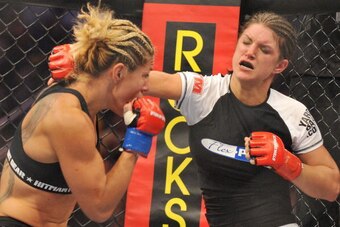 SAN JOSE, CA - AUGUST 15:  Cris Cyborg (L) battles Gina Carano during their Middleweight Championship fight at Stikeforce: Carano vs. Cyborg on August 15, 2009 in San Jose, California.  (Photo by Jon Kopaloff/Getty Images)