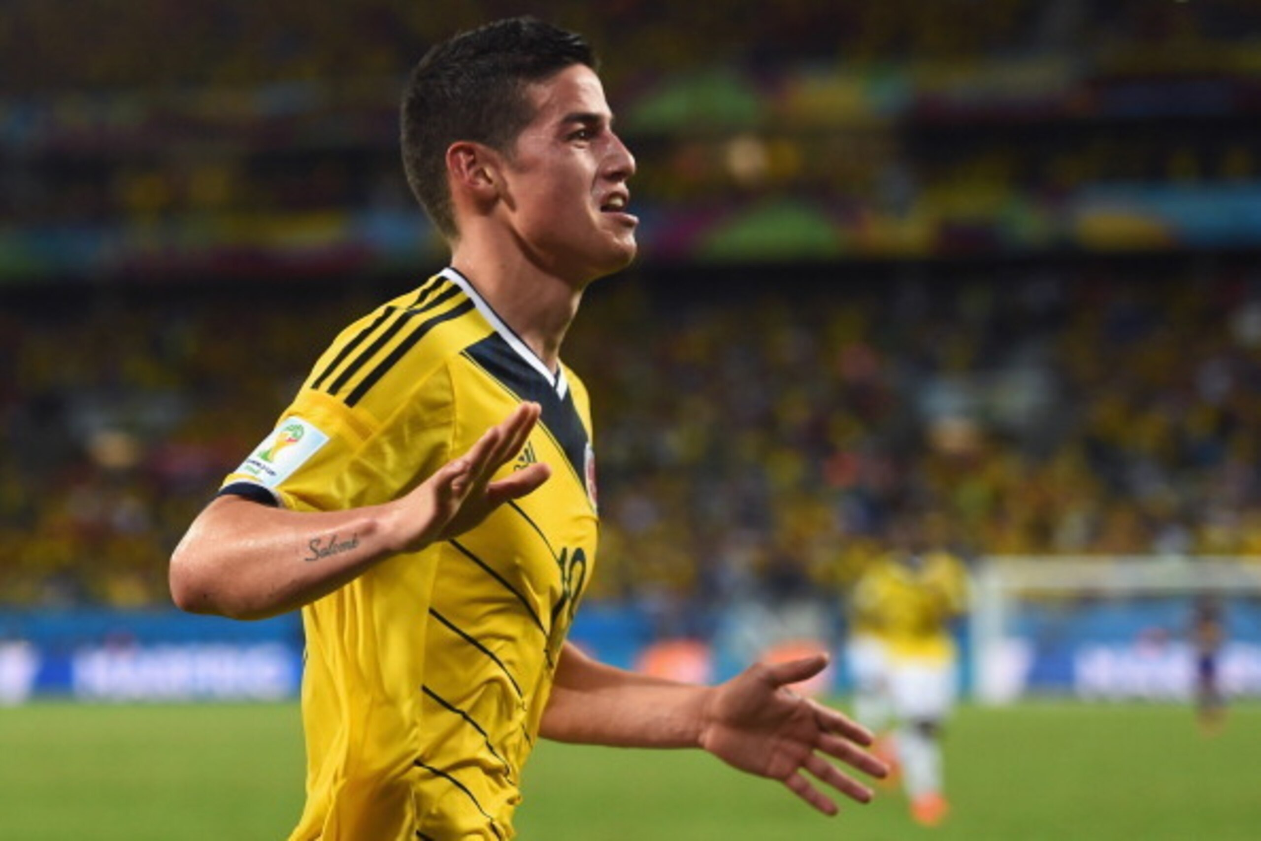 CUIABA, BRAZIL - JUNE 24:  James Rodriguez of Colombia celebrates scoring his team's fourth goal during the 2014 FIFA World Cup Brazil Group C match between Japan and Colombia at Arena Pantanal on June 24, 2014 in Cuiaba, Brazil.  (Photo by Christopher Le