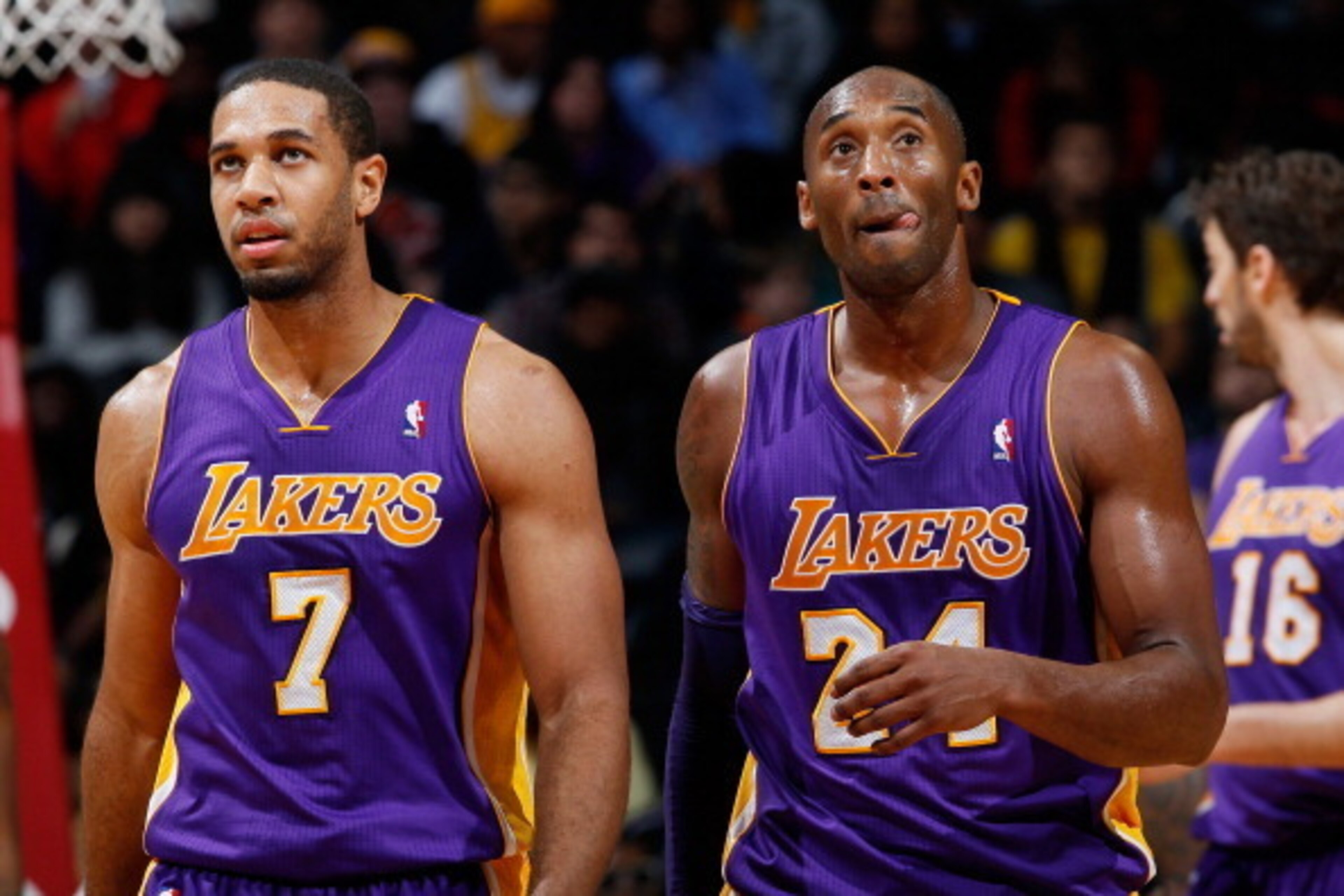 ATLANTA, GA - DECEMBER 16:  Xavier Henry #7 and Kobe Bryant #24 of the Los Angeles Lakers walk off the court during a timeout against the Atlanta Hawks at Philips Arena on December 16, 2013 in Atlanta, Georgia.  NOTE TO USER: User expressly acknowledges a