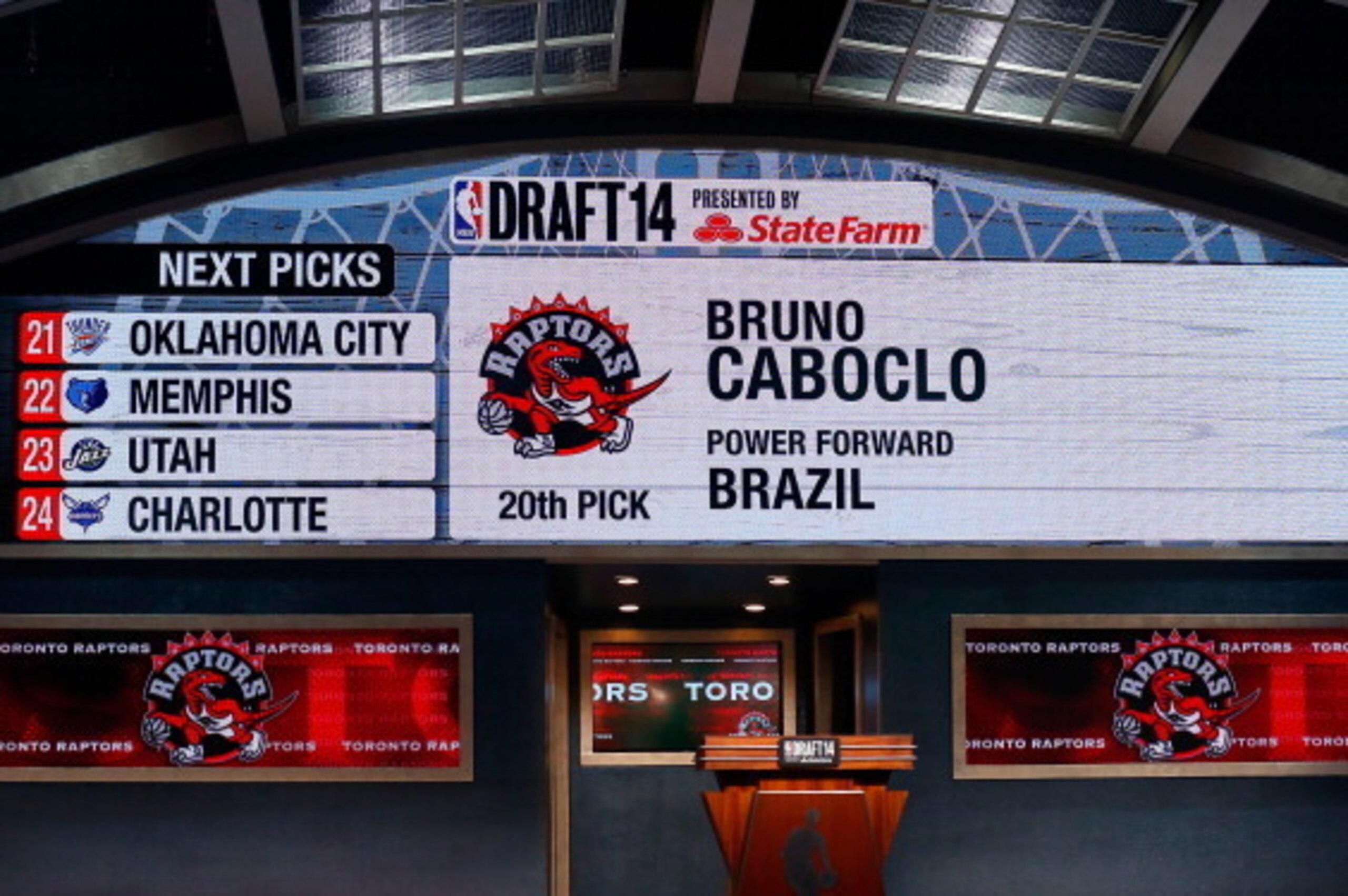 NEW YORK, NY - JUNE 26: A video screen shows the selection of Bruno Caboclo of Brazil as the #20 overall pick in the first round by the Toronto Rapters during the 2014 NBA Draft at Barclays Center on June 26, 2014 in the Brooklyn borough of New York City NEW YORK, NY - JUNE 26: A video screen shows the selection of Bruno Caboclo of Brazil as the #20 overall pick in the first round by the Toronto Rapters during the 2014 NBA Draft at Barclays Center on June 26, 2014 in the Brooklyn borough of New York City