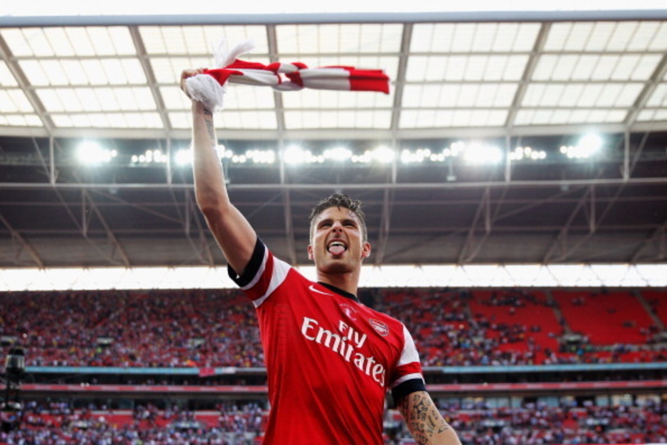 LONDON, ENGLAND - MAY 17:  Olivier Giroud of Arsenal celebrates victory after the FA Cup with Budweiser Final match between Arsenal and Hull City at Wembley Stadium on May 17, 2014 in London, England.  (Photo by Paul Gilham/Getty Images)
