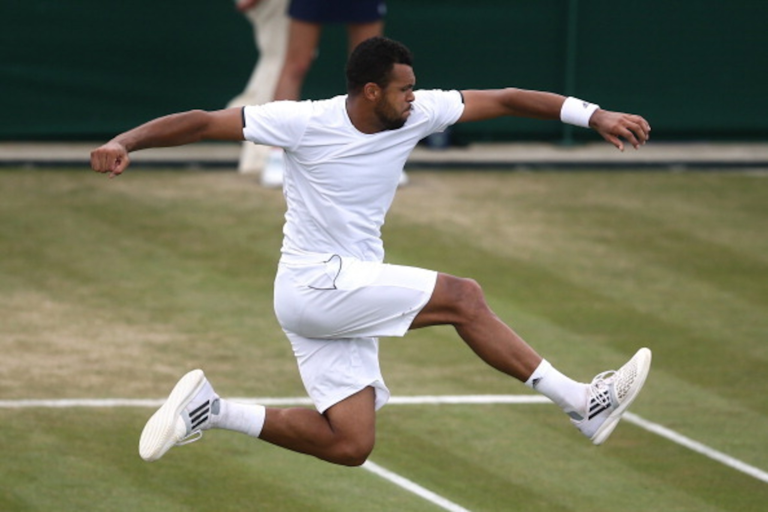 LONDON, ENGLAND - JUNE 27:  Jo-Wilfried Tsonga of France celebrates after winning his Gentlemen's Singles third round match against Jimmy Wang of Chinese Taipei on day five of the Wimbledon Lawn Tennis Championships at the All England Lawn Tennis and Croq
