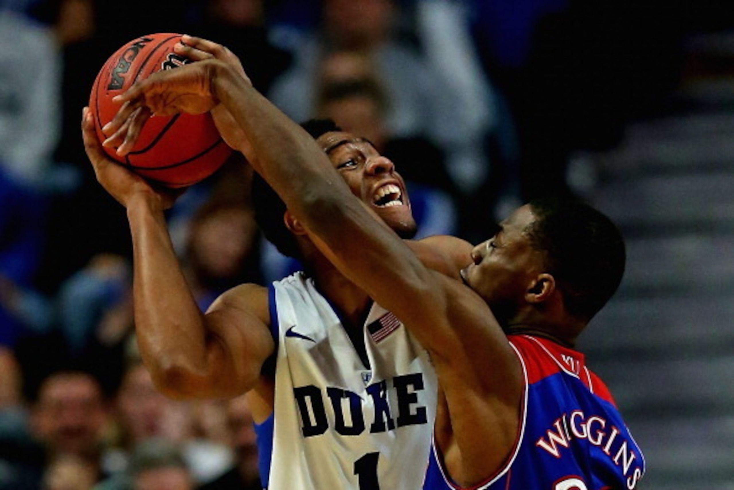 CHICAGO, IL - NOVEMBER 12: Jabari Parker #1 of the Duke Blue Devils tries to shoot against Andrew Wiggins #22 of the Kansas Jayhawks during the State Farm Champions Classic at the United Center on November 12, 2013 in Chicago, Illinois. Kansas defeated Du