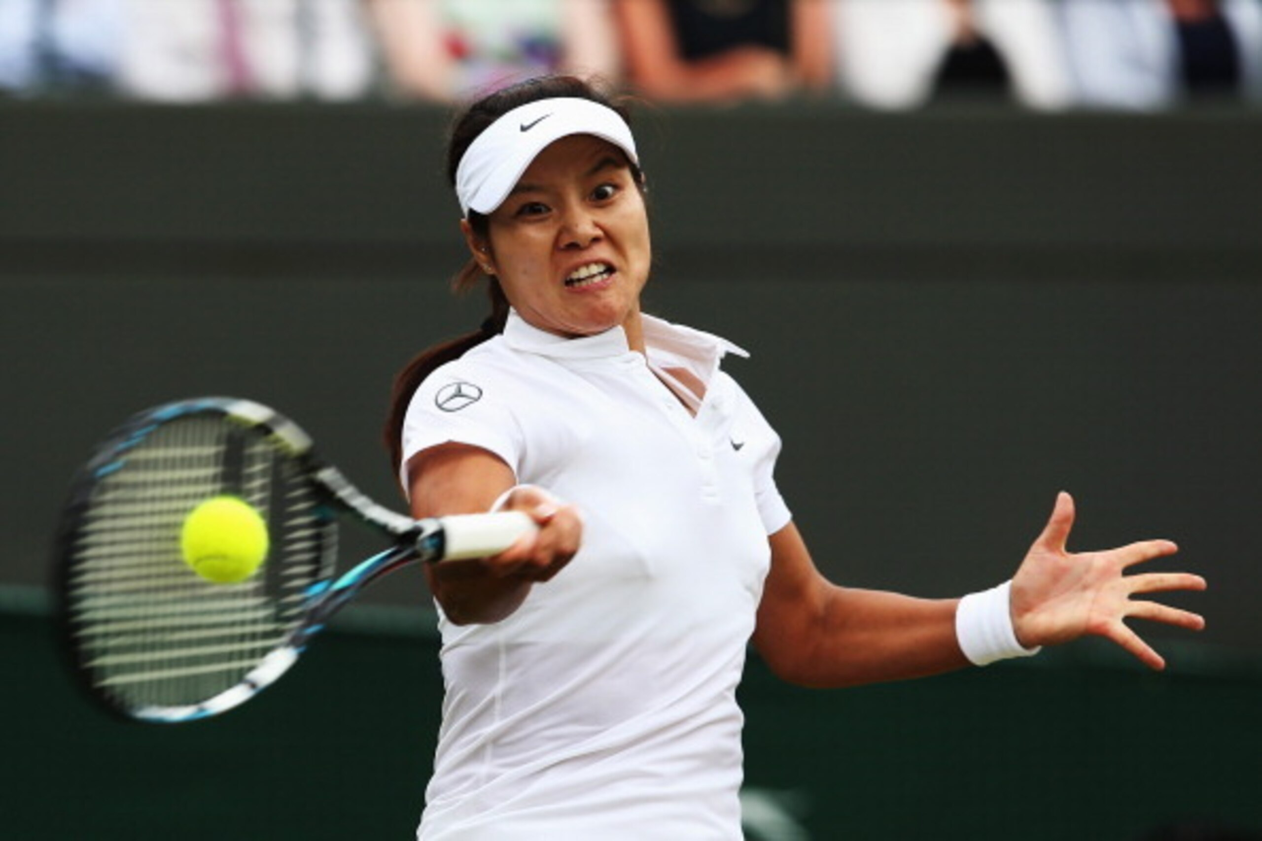 LONDON, ENGLAND - JUNE 27:  Na Li of China plays a forehand return during the Ladies' Singles third round match Barbora Zahlavova Strycova of Czech Republic on day five of the Wimbledon Lawn Tennis Championships at the All England Lawn Tennis and Croquet 