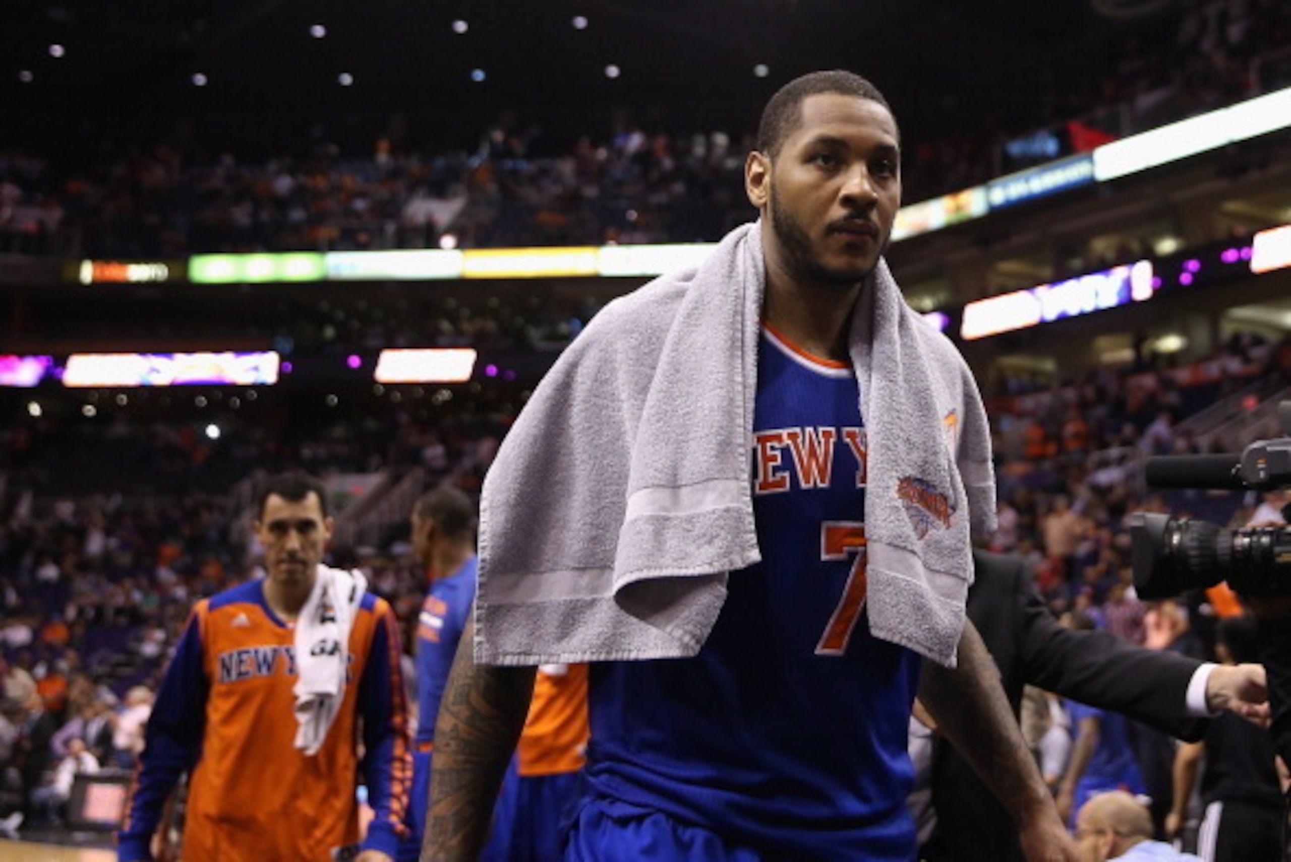 PHOENIX, AZ - MARCH 28: Carmelo Anthony #7 of the New York Knicks walks off the court following the NBA game against the Phoenix Suns at US Airways Center on March 28, 2014 in Phoenix, Arizona. The Suns defeated the Knicks 112-88. NOTE TO USER: User exp PHOENIX, AZ - MARCH 28: Carmelo Anthony #7 of the New York Knicks walks off the court following the NBA game against the Phoenix Suns at US Airways Center on March 28, 2014 in Phoenix, Arizona. The Suns defeated the Knicks 112-88. NOTE TO USER: User exp