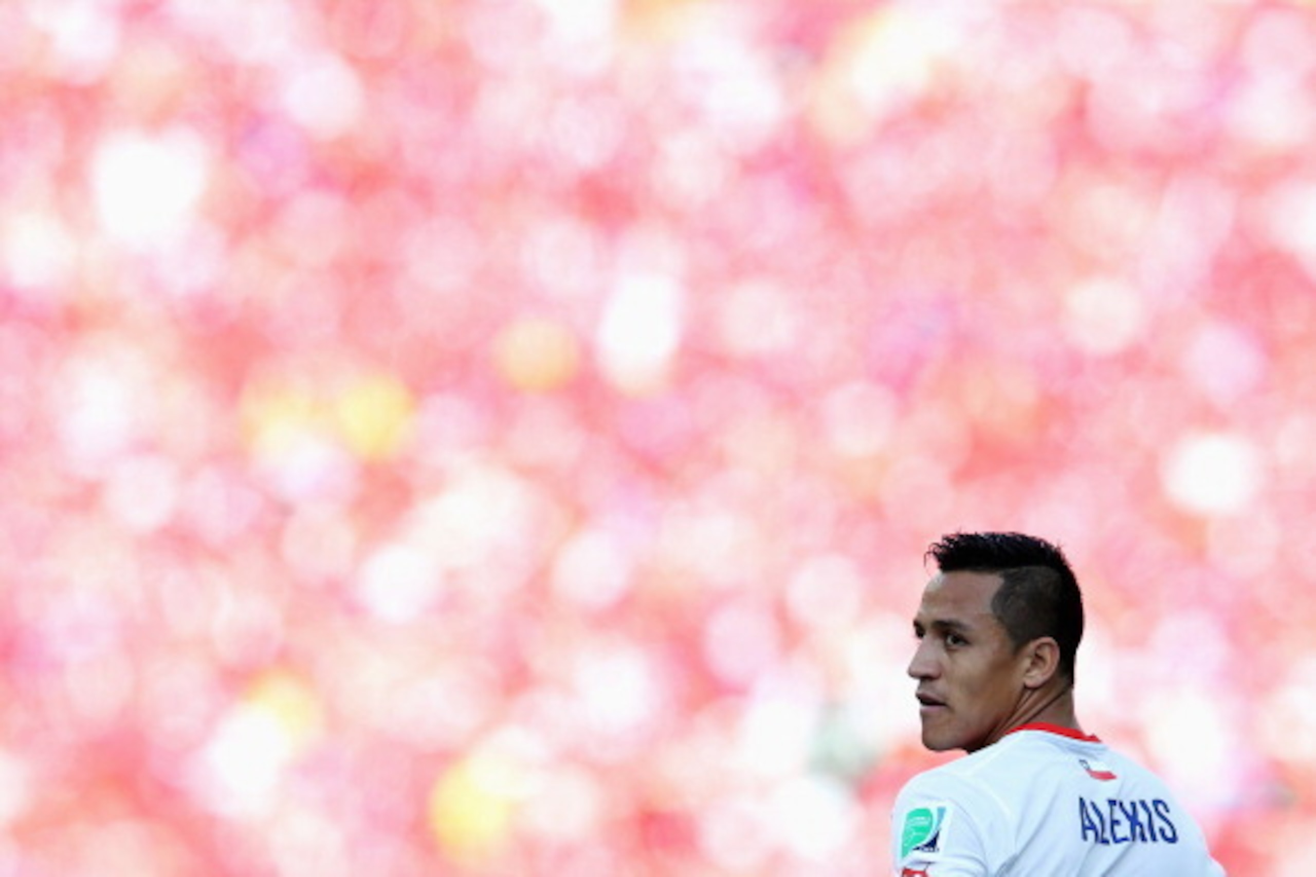 SAO PAULO, BRAZIL - JUNE 23:  Alexis Sanchez of Chile looks on during the 2014 FIFA World Cup Brazil Group B match between the Netherlands and Chile at Arena de Sao Paulo on June 23, 2014 in Sao Paulo, Brazil.  (Photo by Dean Mouhtaropoulos/Getty Images)