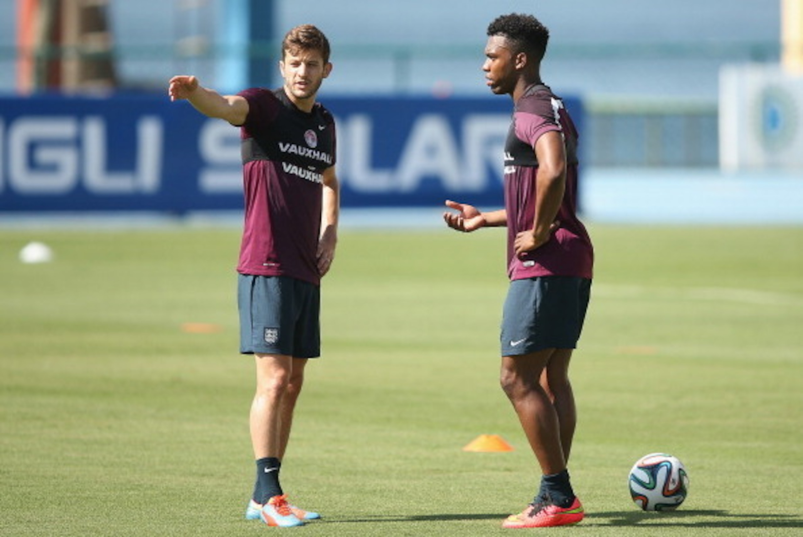 RIO DE JANEIRO, BRAZIL - JUNE 09:  Adam Lallana of England (L) talks with Daniel Sturridge of England during a training session at the Urca military base (Forte de Urca) training ground on June 9, 2014 in Rio de Janeiro, Brazil.  (Photo by Richard Heathco