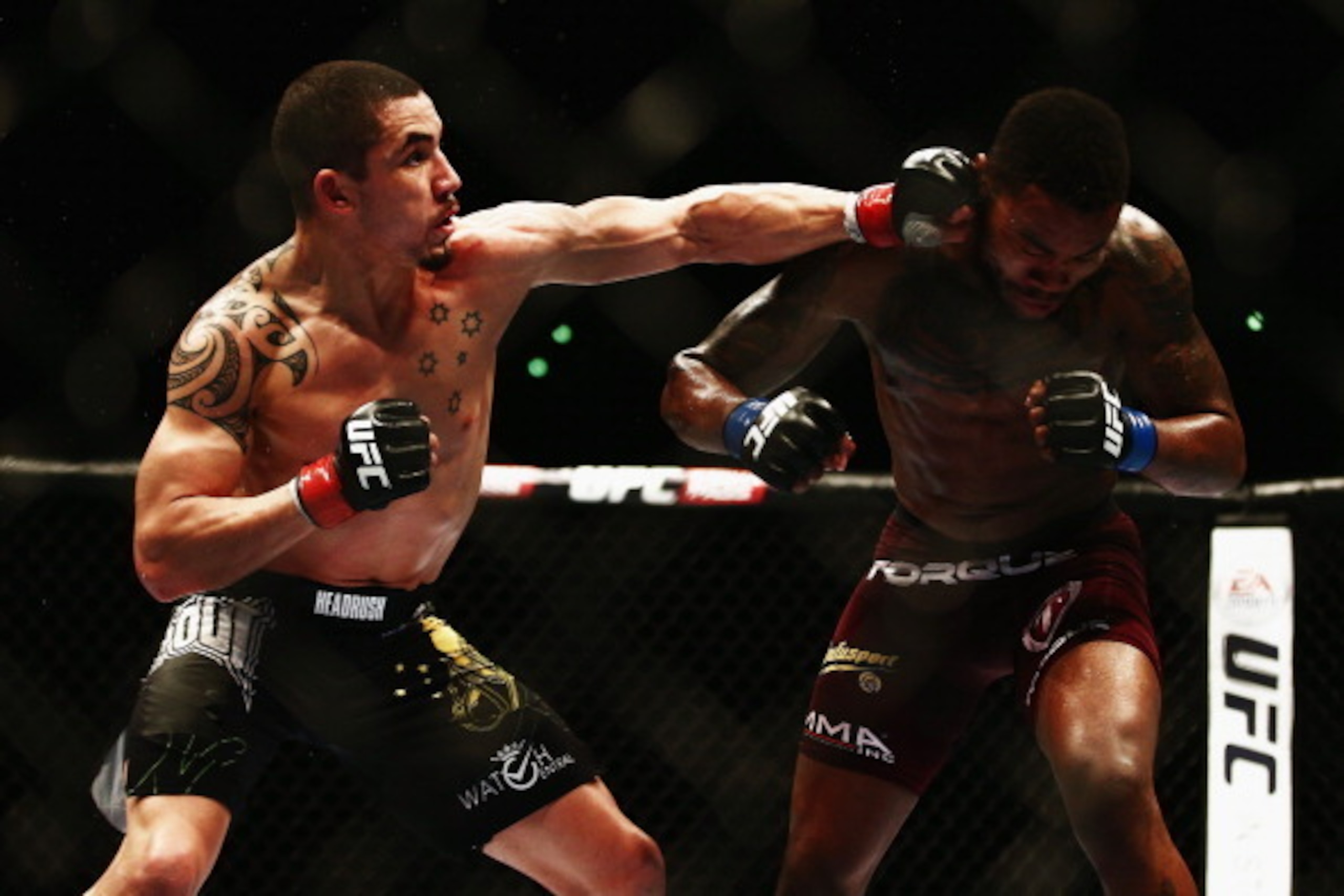 AUCKLAND, NEW ZEALAND - JUNE 28: Robert Whittaker of New Zealand fights Mike Rhodes of USA during the UFC Welterweight bout between Robert Whittaker of New Zealand and Mike Rhodes of USA on June 28, 2014 in Auckland, New Zealand. (Photo by Hannah Peters AUCKLAND, NEW ZEALAND - JUNE 28: Robert Whittaker of New Zealand fights Mike Rhodes of USA during the UFC Welterweight bout between Robert Whittaker of New Zealand and Mike Rhodes of USA on June 28, 2014 in Auckland, New Zealand. (Photo by Hannah Peters