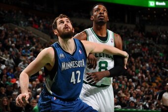 BOSTON, MA - DECEMBER 16: Kevin Love #42 of the Minnesota Timberwolves boxes out Jeff Green #8 of the Boston Celtics on December 16, 2013 at the TD Garden in Boston, Massachusetts.  NOTE TO USER: User expressly acknowledges and agrees that, by downloading