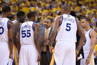 May 1, 2014; Oakland, CA, USA; Golden State Warriors head coach Mark Jackson (center) instructs his team in a huddle during the second quarter in game six of the first round of the 2014 NBA Playoffs against the Los Angeles Clippers at Oracle Arena. The Wa