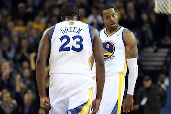Feb 6, 2014; Oakland, CA, USA; Golden State Warriors small forward Andre Iguodala (9) celebrates with small forward Draymond Green (23) after Green's dunk against the Chicago Bulls during the third quarter at Oracle Arena. The Golden State Warriors defeat
