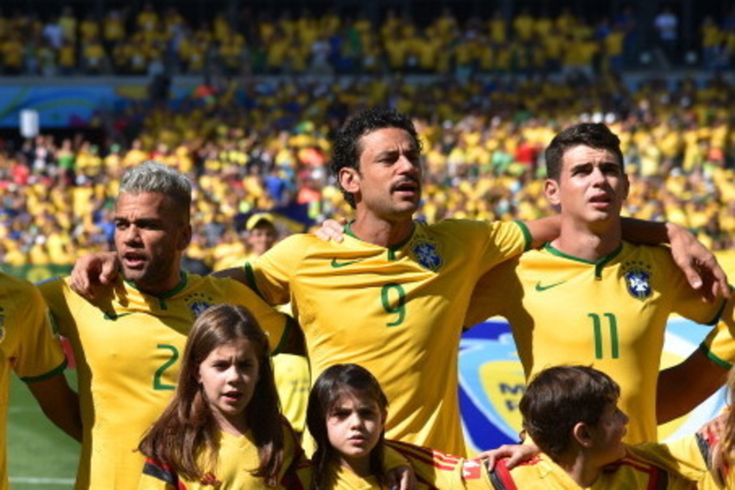 BELO HORIZONTE, BRAZIL - JUNE 28: (L-R) Neymar, Dani Alves, Fred and Oscar of Brazil sing the National Anthem prior to the 2014 FIFA World Cup Brazil round of 16 match between Brazil and Chile at Estadio Mineirao on June 28, 2014 in Belo Horizonte, Brazi BELO HORIZONTE, BRAZIL - JUNE 28: (L-R) Neymar, Dani Alves, Fred and Oscar of Brazil sing the National Anthem prior to the 2014 FIFA World Cup Brazil round of 16 match between Brazil and Chile at Estadio Mineirao on June 28, 2014 in Belo Horizonte, Brazi