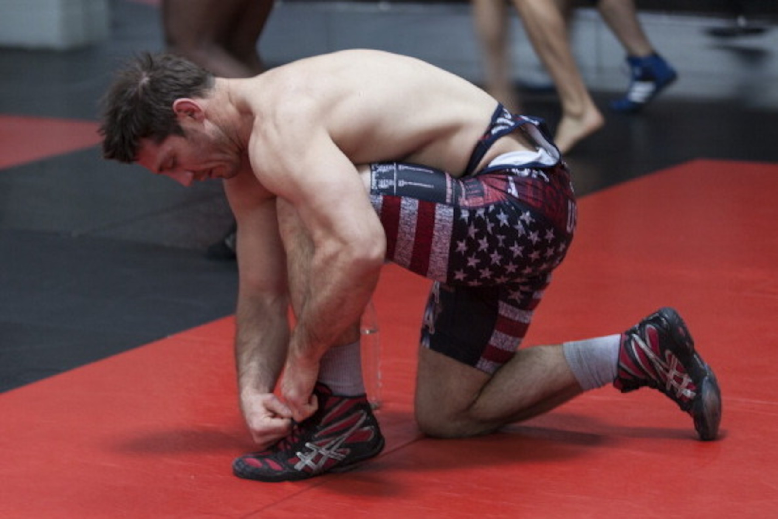 ALBUQUERQUE, NM - APRIL 2: UFC middleweight weight contender Tim Kennedy laces up his shoes before warming up during an open training session for fans and media at the Jackson's Mixed Martial Arts and Fitnesson April 2, 2014 in Albuquerque, New Mexico. (P