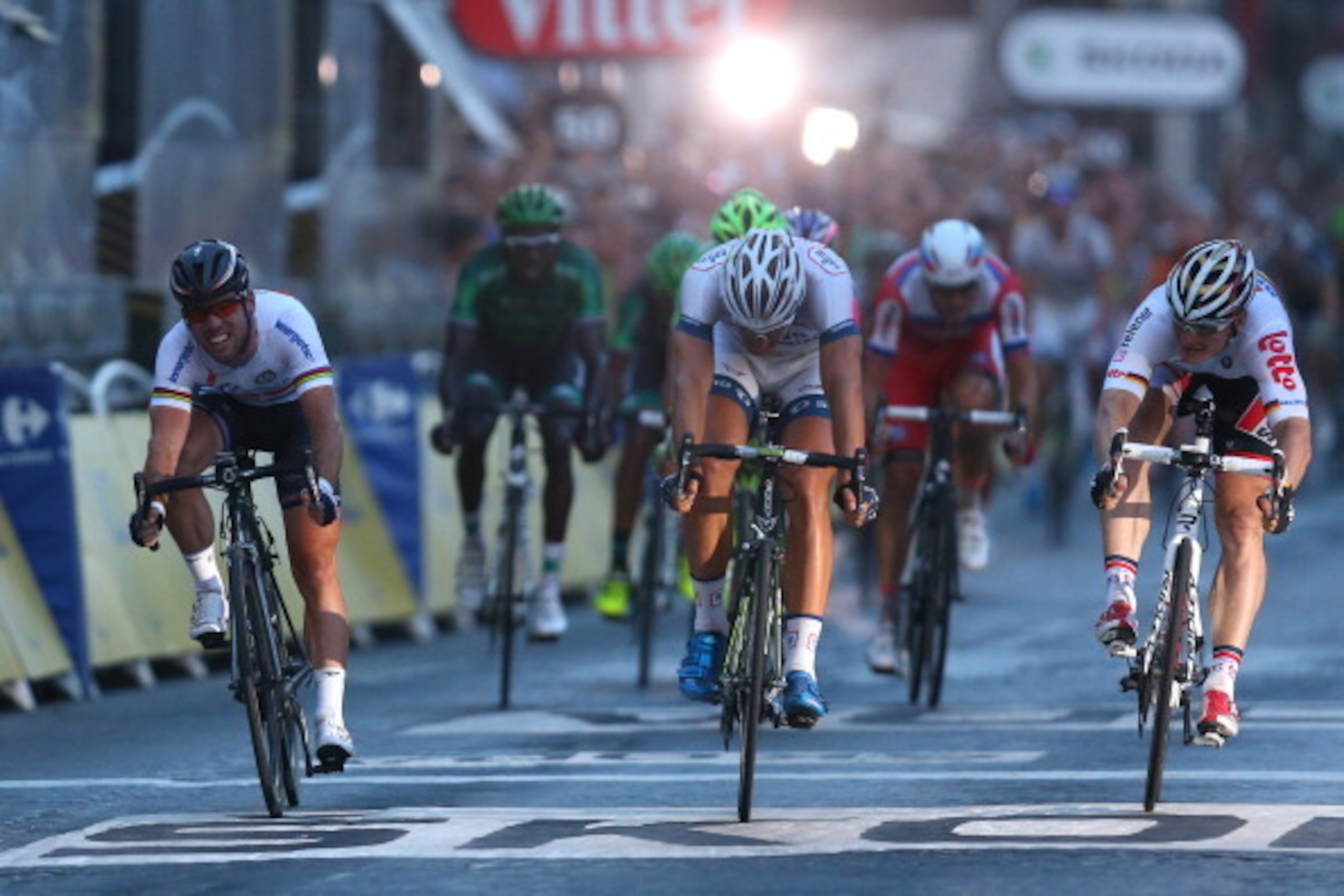 PARIS, FRANCE - JULY 21: Marcel Kittel of Germany and Team Argos-Shimano (C) beats Mark Cavendish of Omega Pharma-Quickstep (L) and Andre Greipel of Lotto Belisol in the sprint during the twenty first and final stage of the 2013 Tour de France, a processi