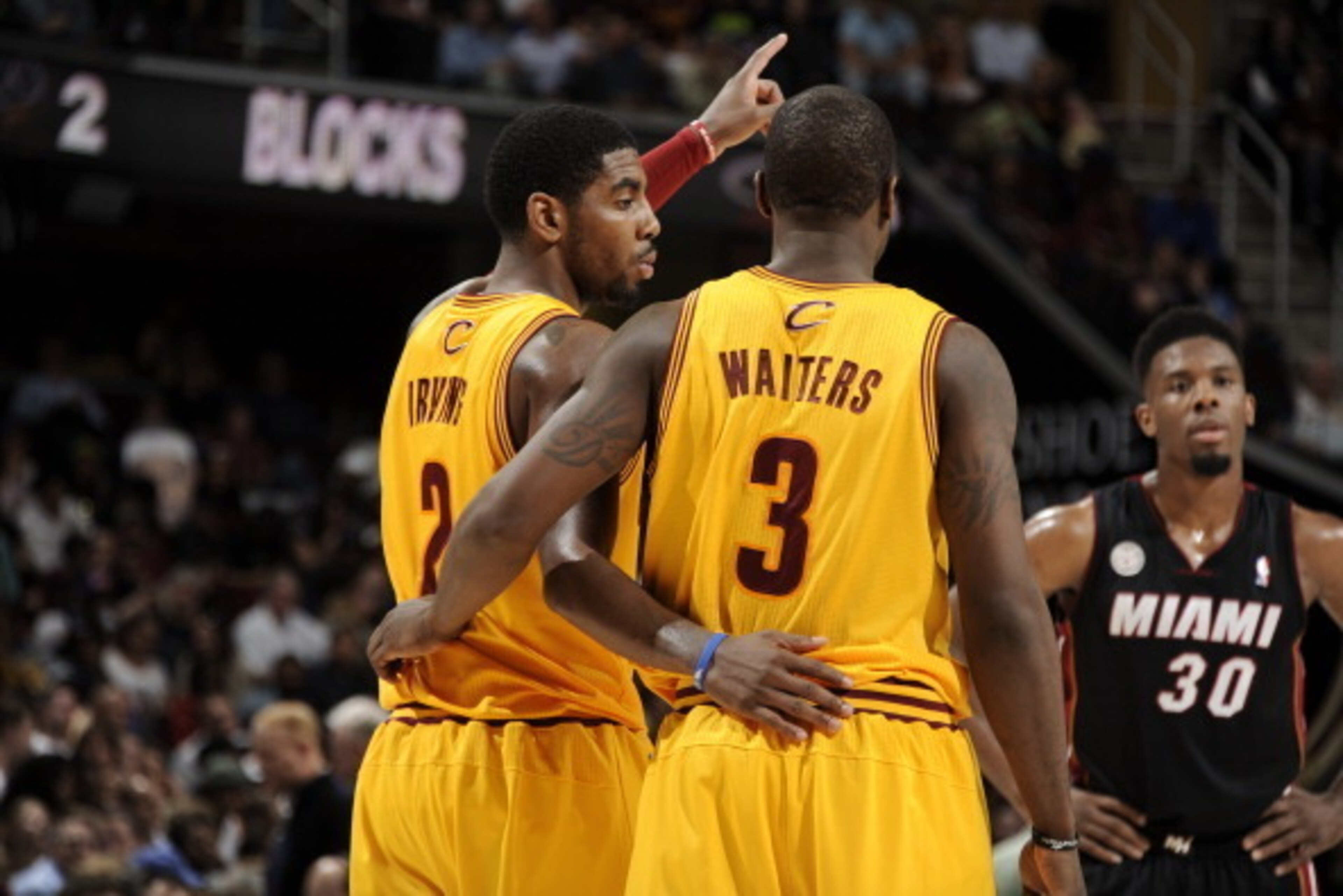 CLEVELAND, OH - APRIL 15:  Kyrie Irving #2 and Dion Waiters #3 of the Cleveland Cavaliers discuss the play during a break in the action against of the Miami Heat at The Quicken Loans Arena on April 15, 2013 in Cleveland, Ohio. NOTE TO USER: User expressly