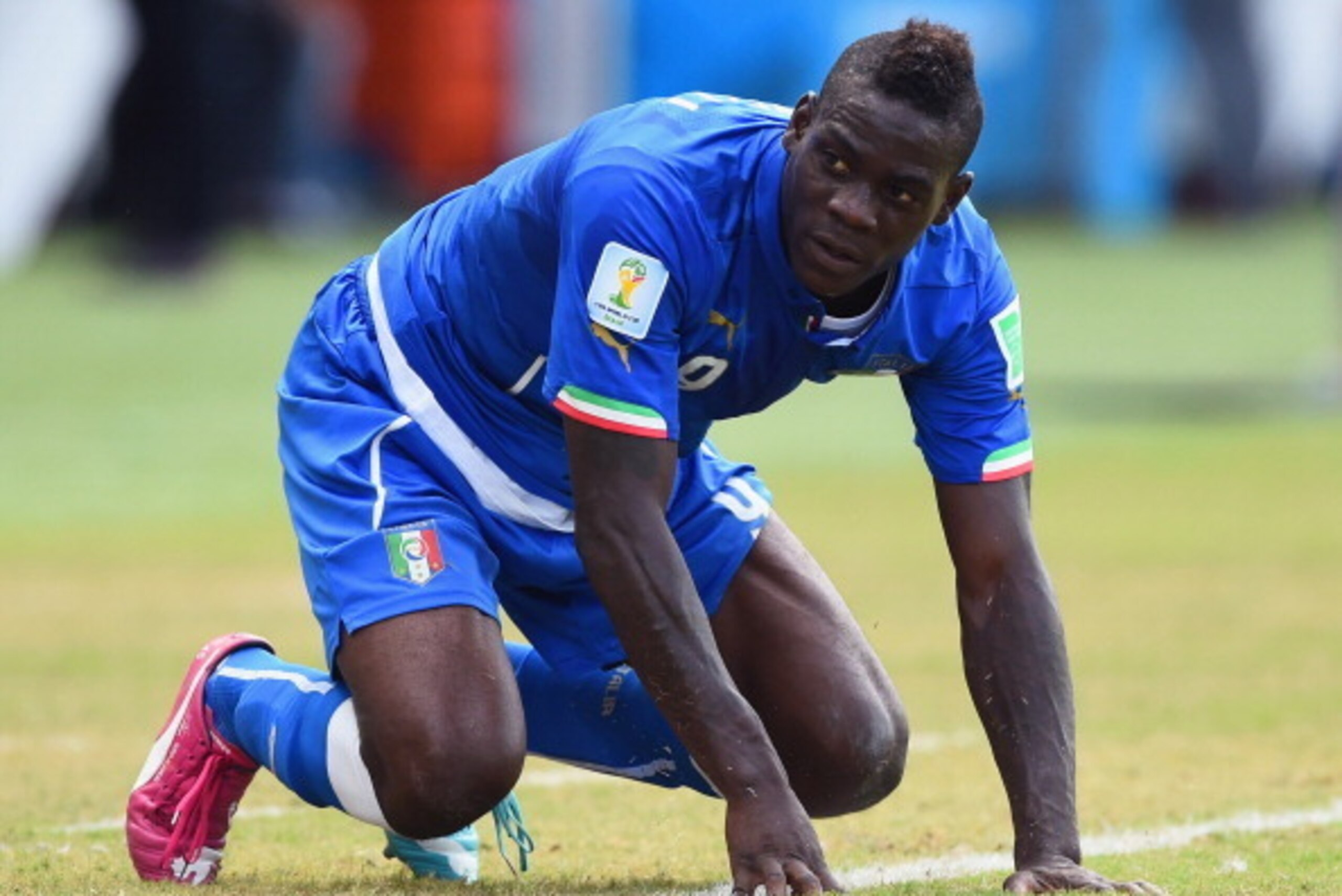 NATAL, BRAZIL - JUNE 24: Mario Balotelli of Italy reacts during the 2014 FIFA World Cup Brazil Group D match between Italy and Uruguay at Estadio das Dunas on June 24, 2014 in Natal, Brazil. (Photo by Matthias Hangst/Getty Images) NATAL, BRAZIL - JUNE 24: Mario Balotelli of Italy reacts during the 2014 FIFA World Cup Brazil Group D match between Italy and Uruguay at Estadio das Dunas on June 24, 2014 in Natal, Brazil. (Photo by Matthias Hangst/Getty Images)