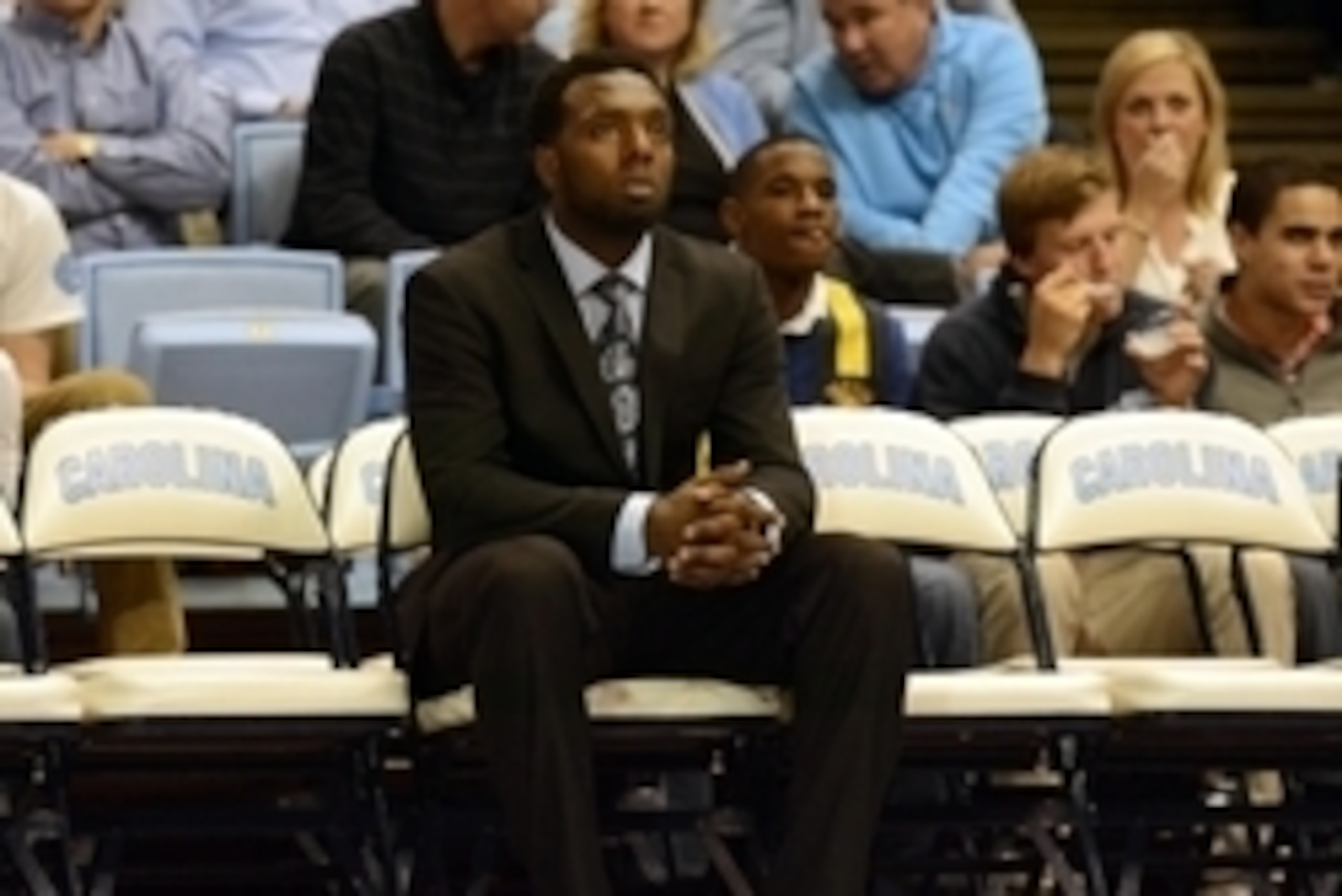 Dec 18, 2013; Chapel Hill, NC, USA; Suspended North Carolina Tar Heels guard P.J. Hairston (center) watches his team warm up prior to the second half against the Texas Longhorns at the Dean E. Smith Student Activities Center.  Texas won 86-83. Mandatory C