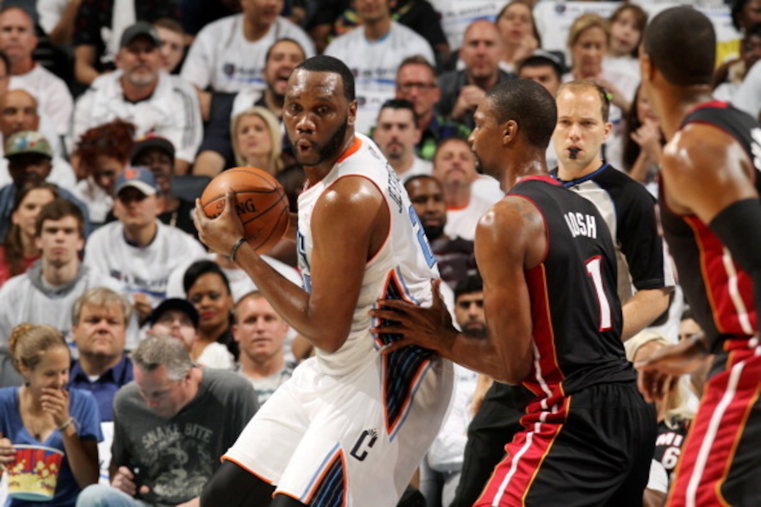 CHARLOTTE, NC - APRIL 26: Al Jefferson #25 of the Charlotte Bobcats handles the ball against the Miami Heat in Game Three of the Eastern Conference Quarterfinals of the 2014 NBA playoffs at the Time Warner Cable Arena on April 26, 2014 in Charlotte, North