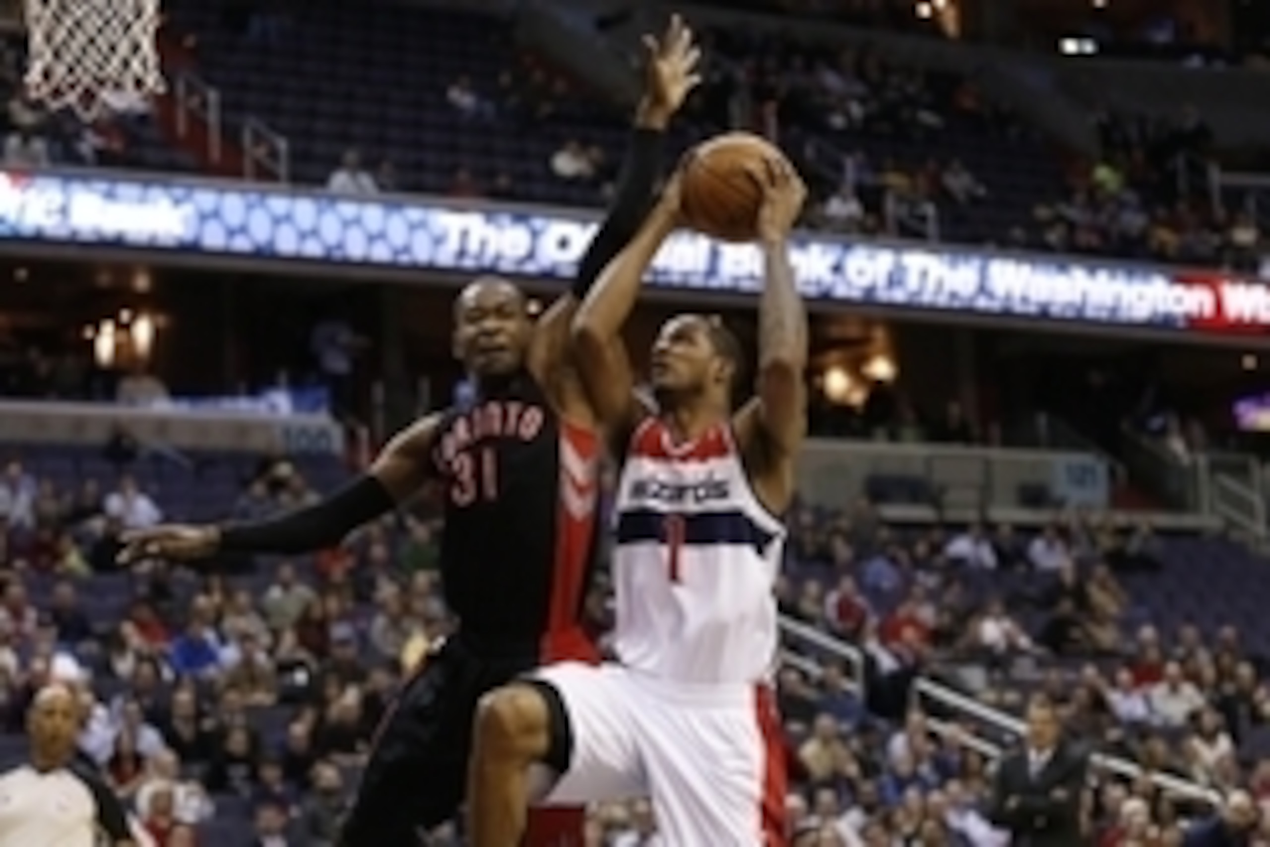 Feb 18, 2014; Washington, DC, USA; Washington Wizards small forward Trevor Ariza (1) shoots the ball as Toronto Raptors small forward Terrence Ross (31) defends in the first quarter at Verizon Center. Mandatory Credit: Geoff Burke-USA TODAY Sports