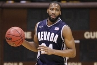 Jan 25, 2014; Laramie, WY, USA; Nevada Wolf Pack guard Deonte Burton (24) dribbles against the Wyoming Cowboys during the first half at the Arena-Auditorium. The Cowboys beat the Wolf Pack 64-62 in overtime. Mandatory Credit: Troy Babbitt-USA TODAY Sports
