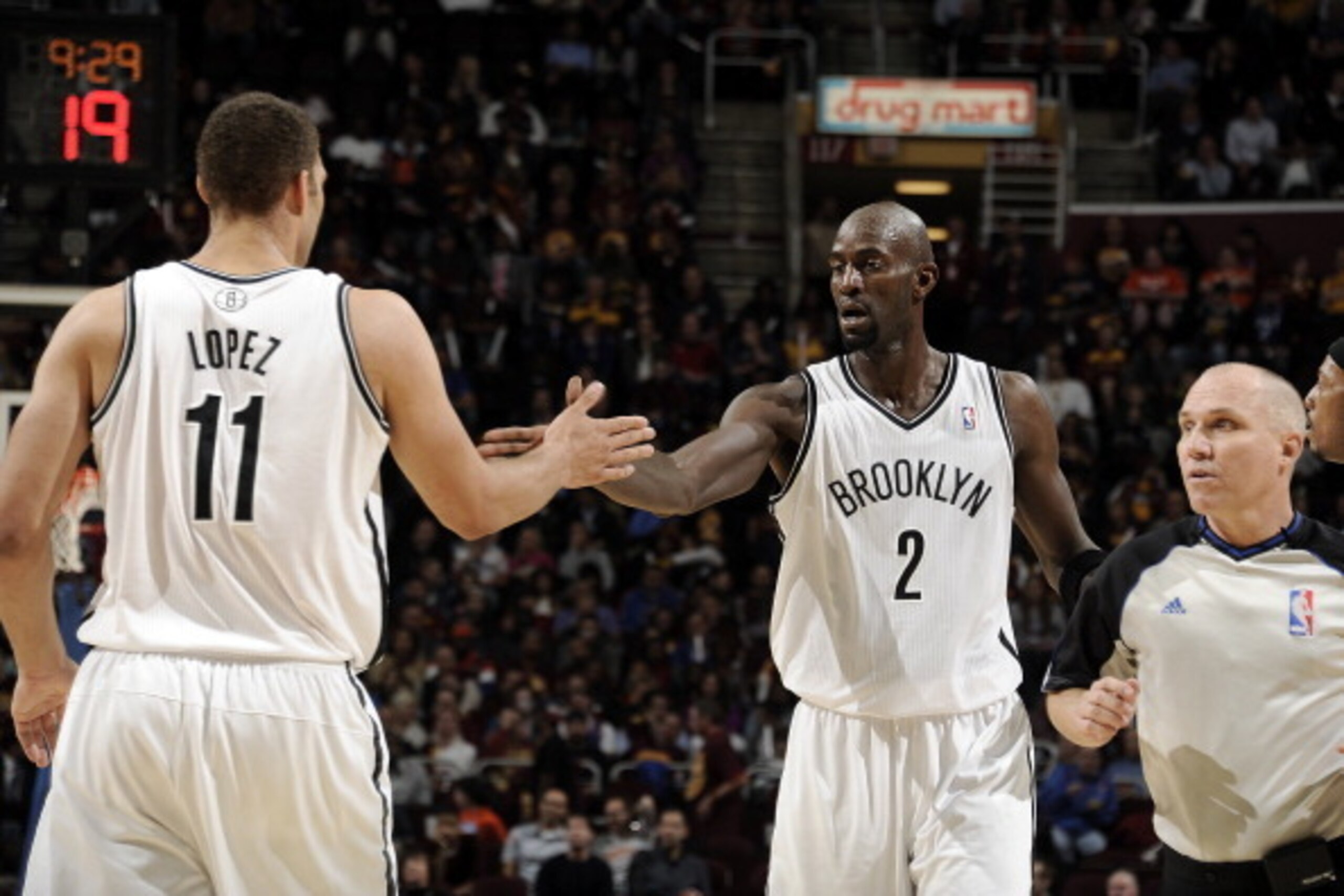 CLEVELAND, OH - OCTOBER 30:  Brook Lopez #11 of the Brooklyn Nets congratulates Kevin Garnett #2 after he made a shot against the Cleveland Cavaliers at The Quicken Loans Arena on October 30, 2013 in Cleveland, Ohio. NOTE TO USER: User expressly acknowled